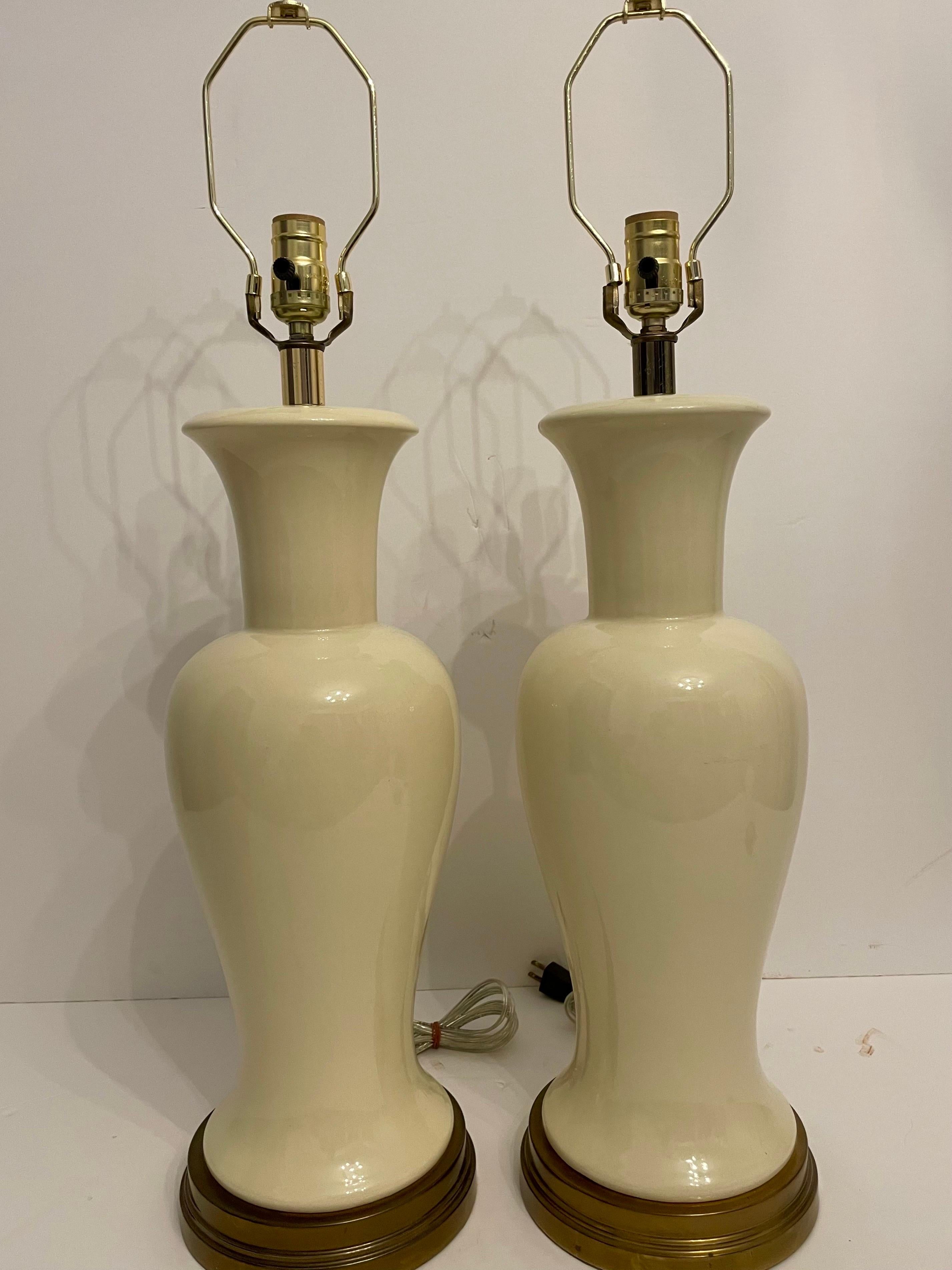 Pair ginger jar form table lamps on patinated bases. Rewired, ready to use. 24