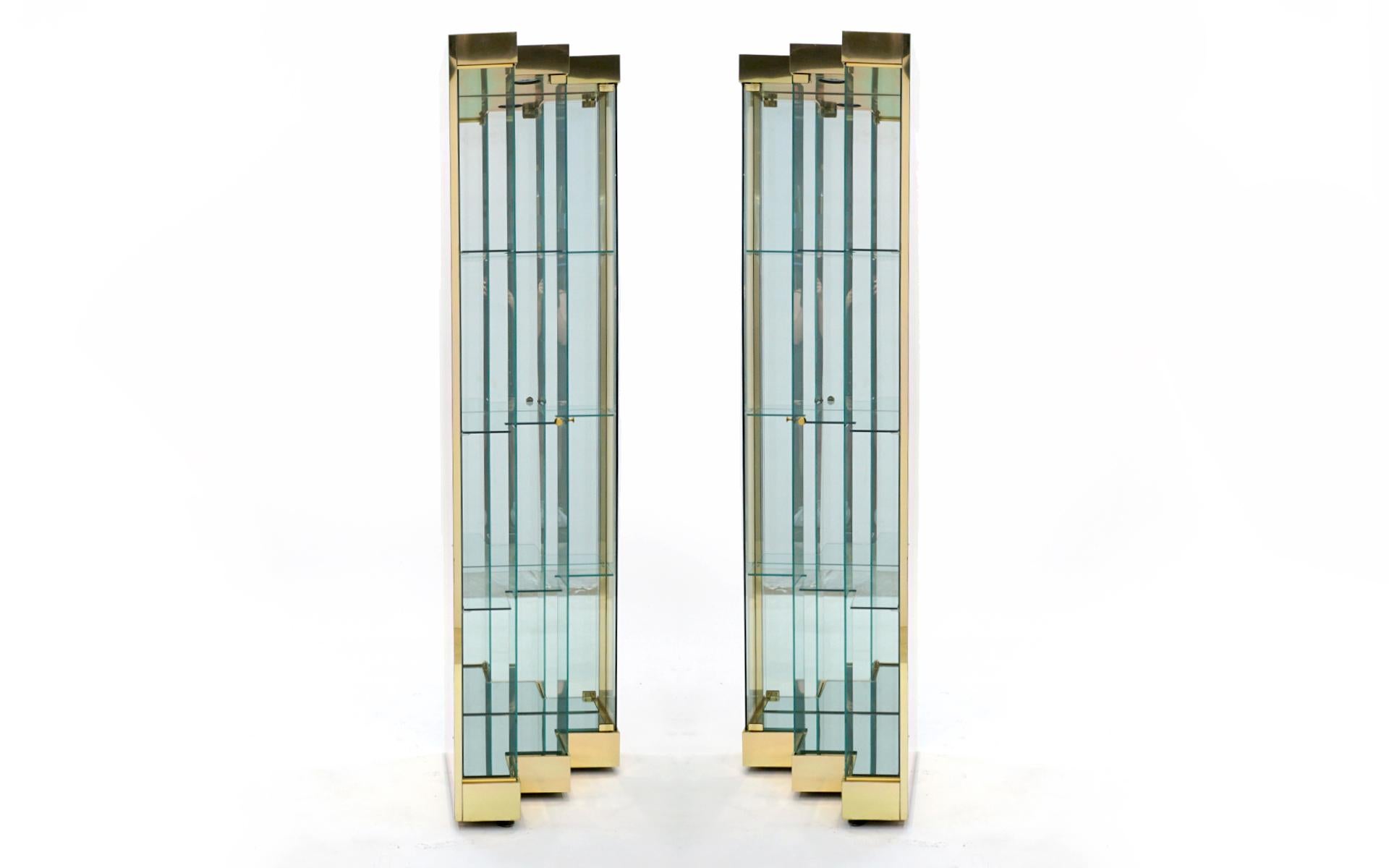 Hollywood Regency Pair Glass and Brass Display Cabinets. Corner or Freestanding w/ Stairstep doors