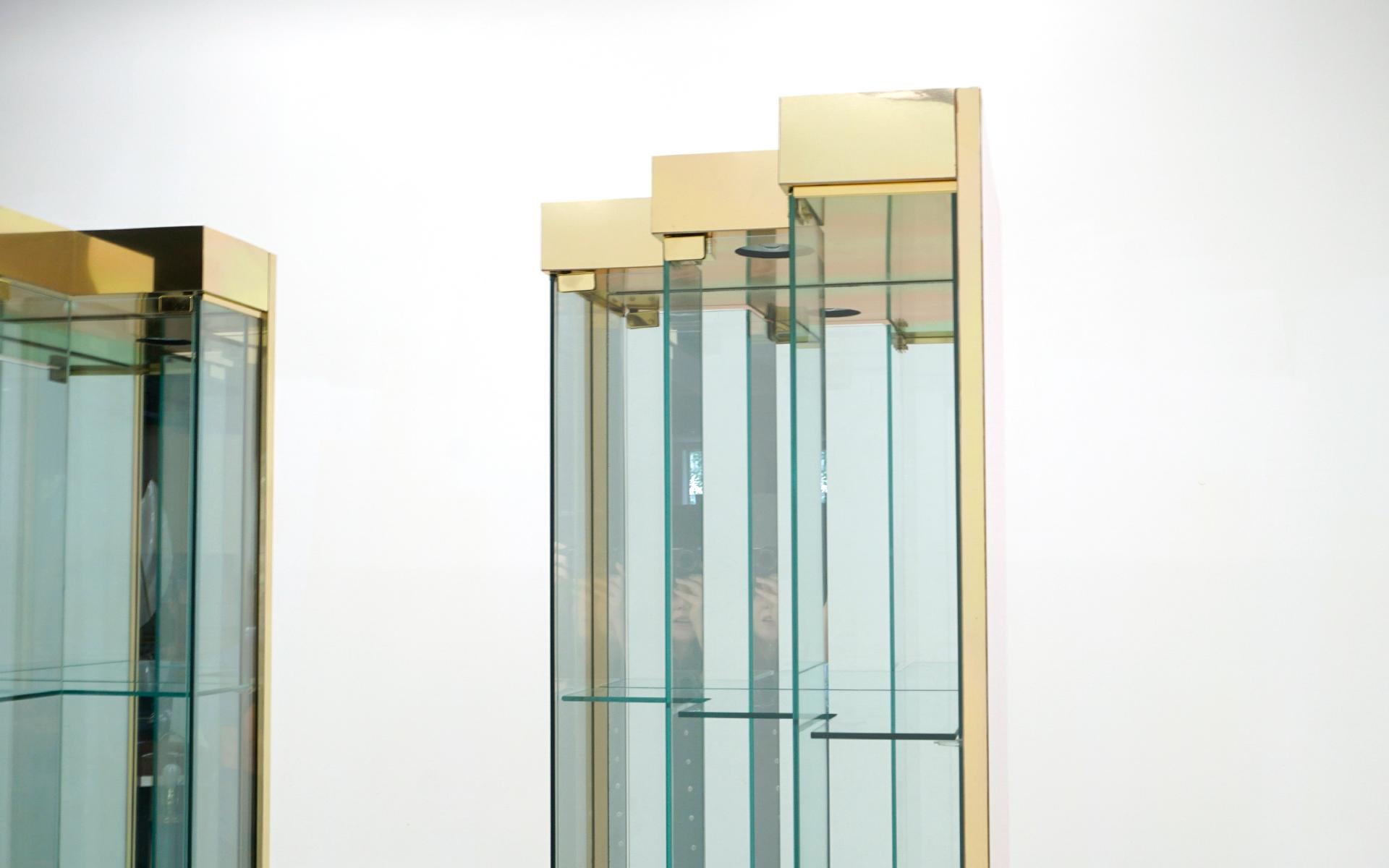 American Pair Glass and Brass Display Cabinets. Corner or Freestanding w/ Stairstep doors