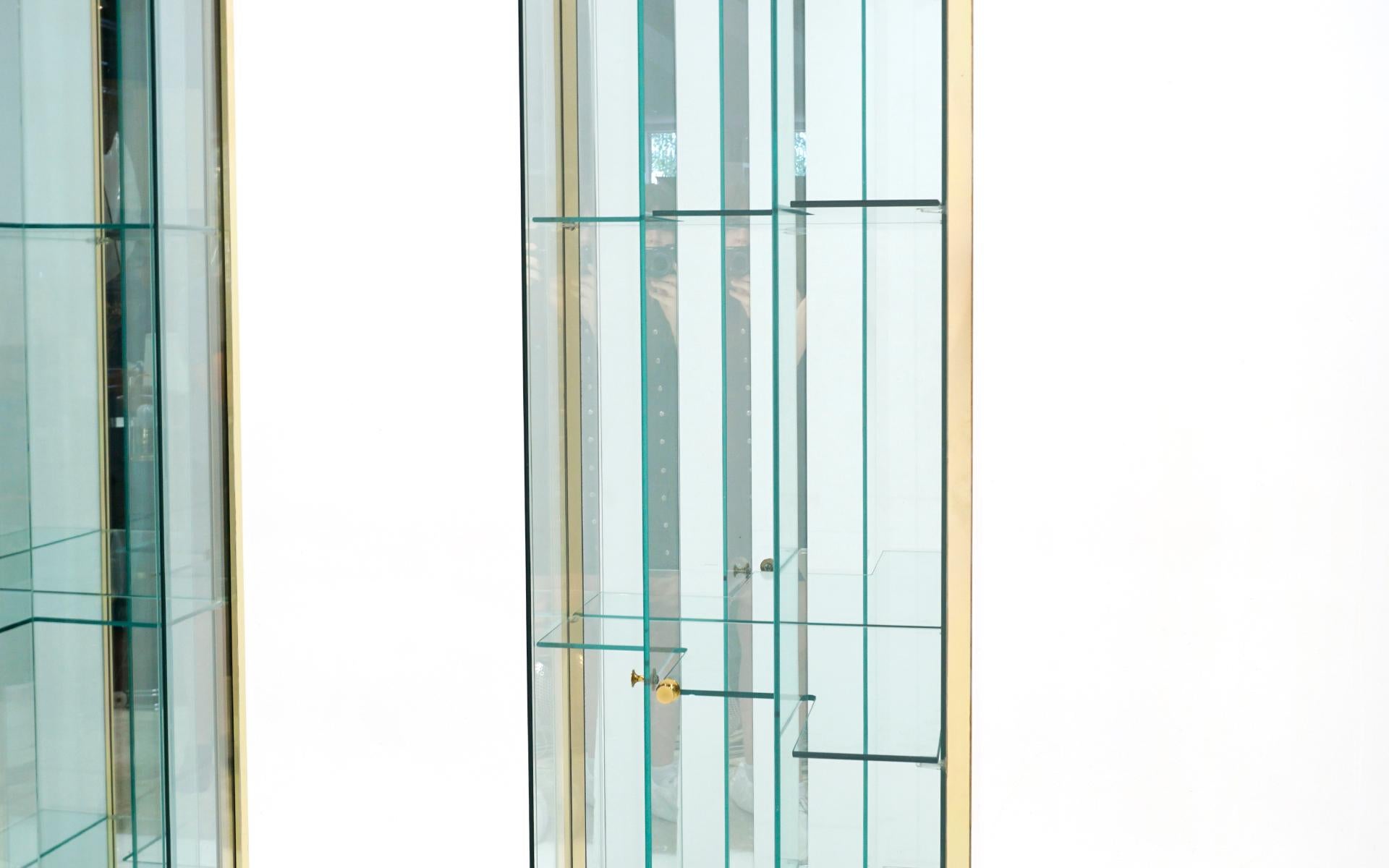 Pair Glass and Brass Display Cabinets. Corner or Freestanding w/ Stairstep doors In Good Condition In Kansas City, MO