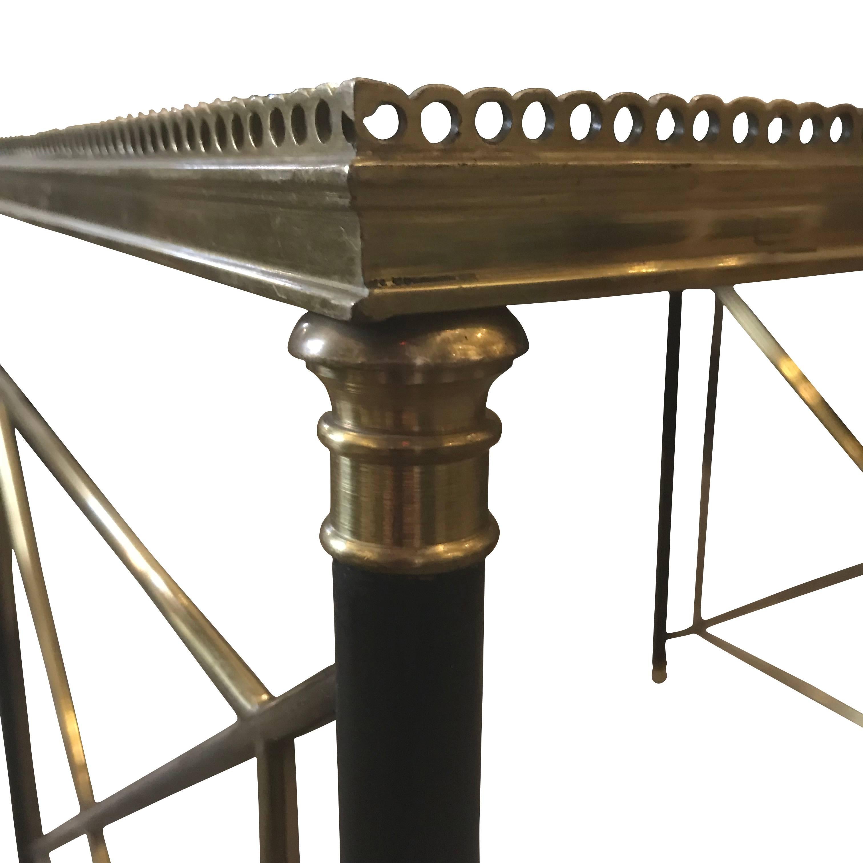 1960s French pair of bronze and black metal glass coffee tables in the style of Maison Jansen.
 