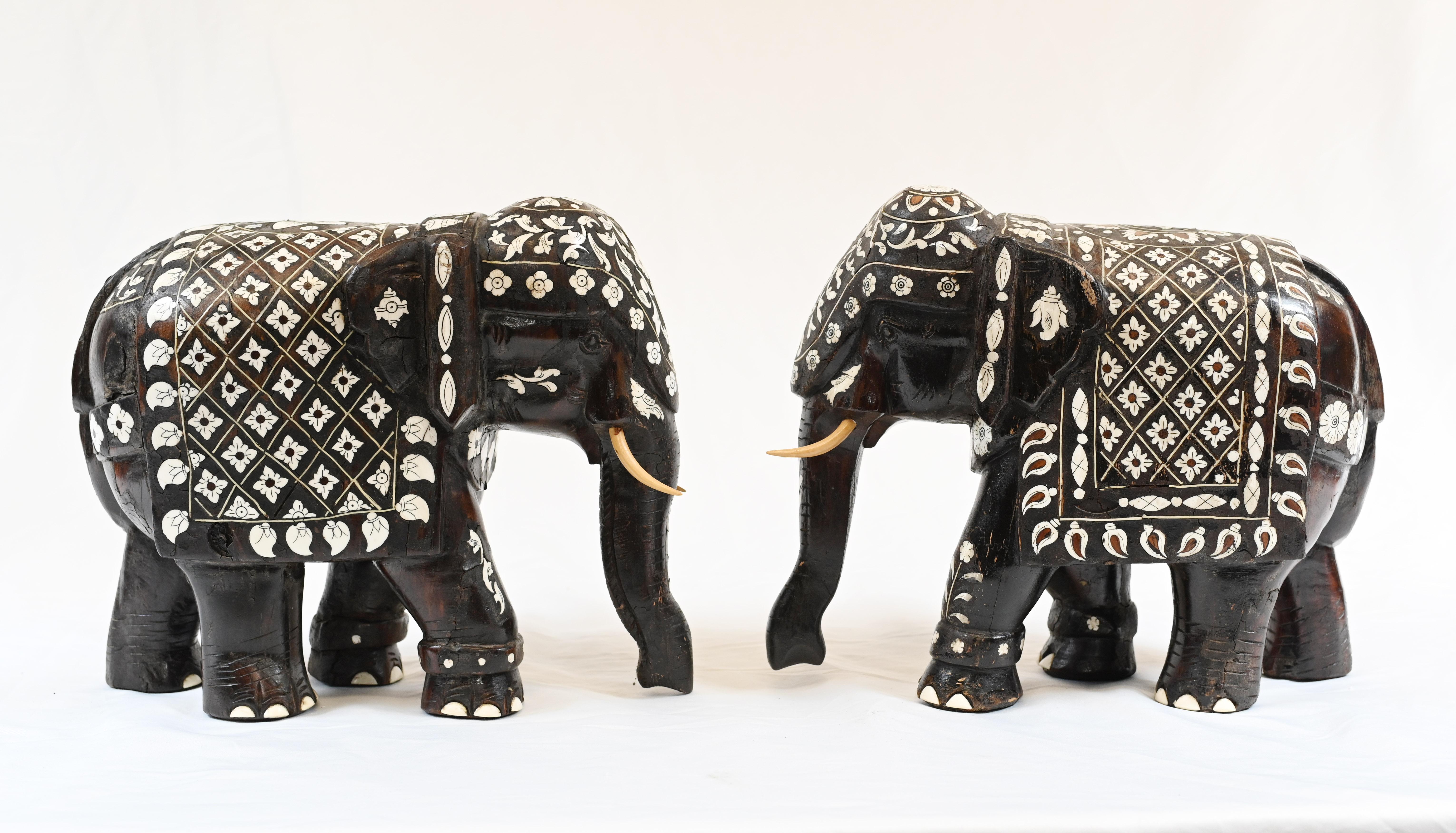 Pair of indian/ goanese hardwood ebony elephants with bone inlays and painted faux tusks circa 1880
Inlay work very detailed and intricate
Great collectable pair of carved elephants 
Some of our items are in storage so please check ahead of a