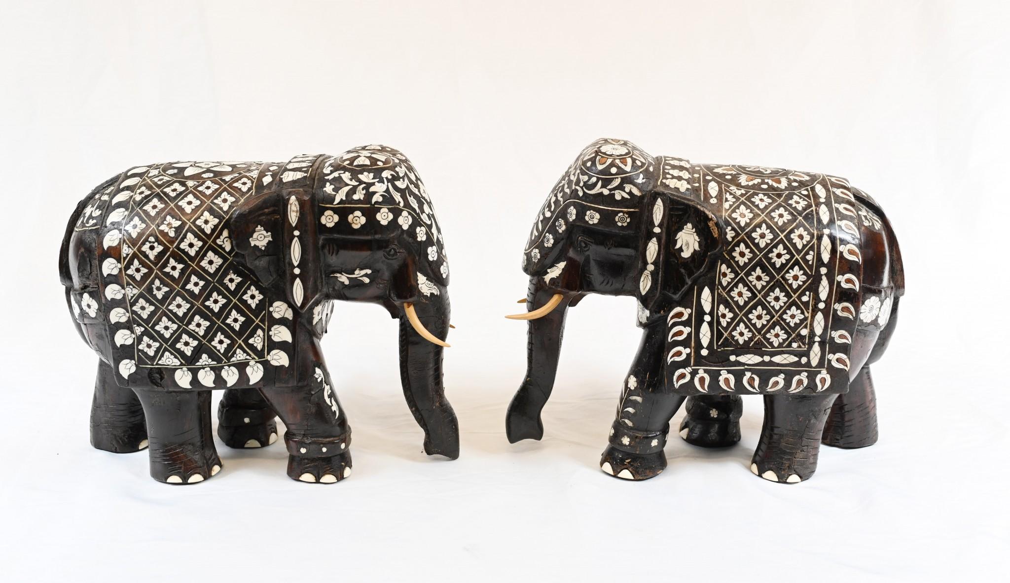 Pair of indian/ goanese hardwood ebony elephants with bone inlays and painted faux tusks circa 1880
Inlay work very detailed and intricate
Great collectable pair of carved elephants 
Some of our items are in storage so please check ahead of a