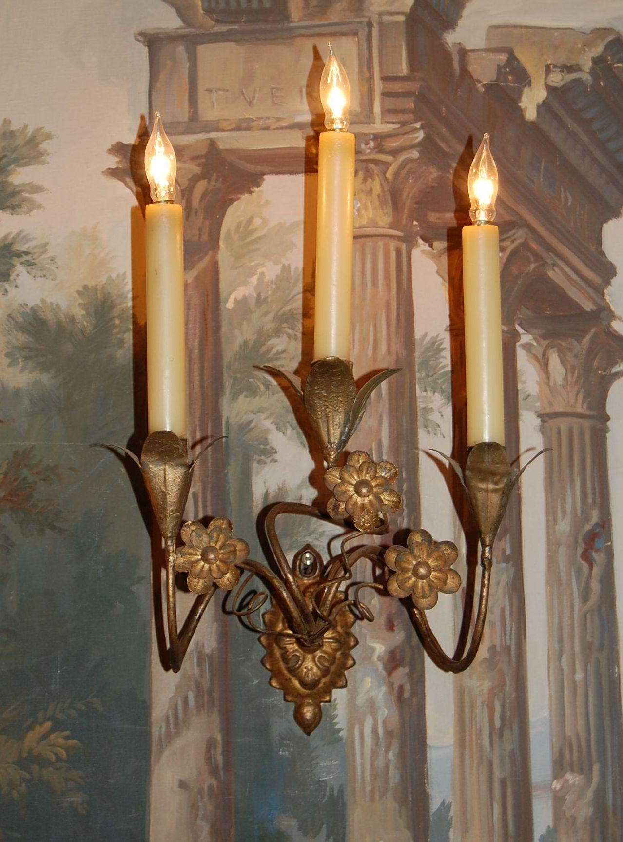 Pair of gold leaf tole sconces from the Chester Lehman estate in Italy. Wax candle covers, early 19th century.
  