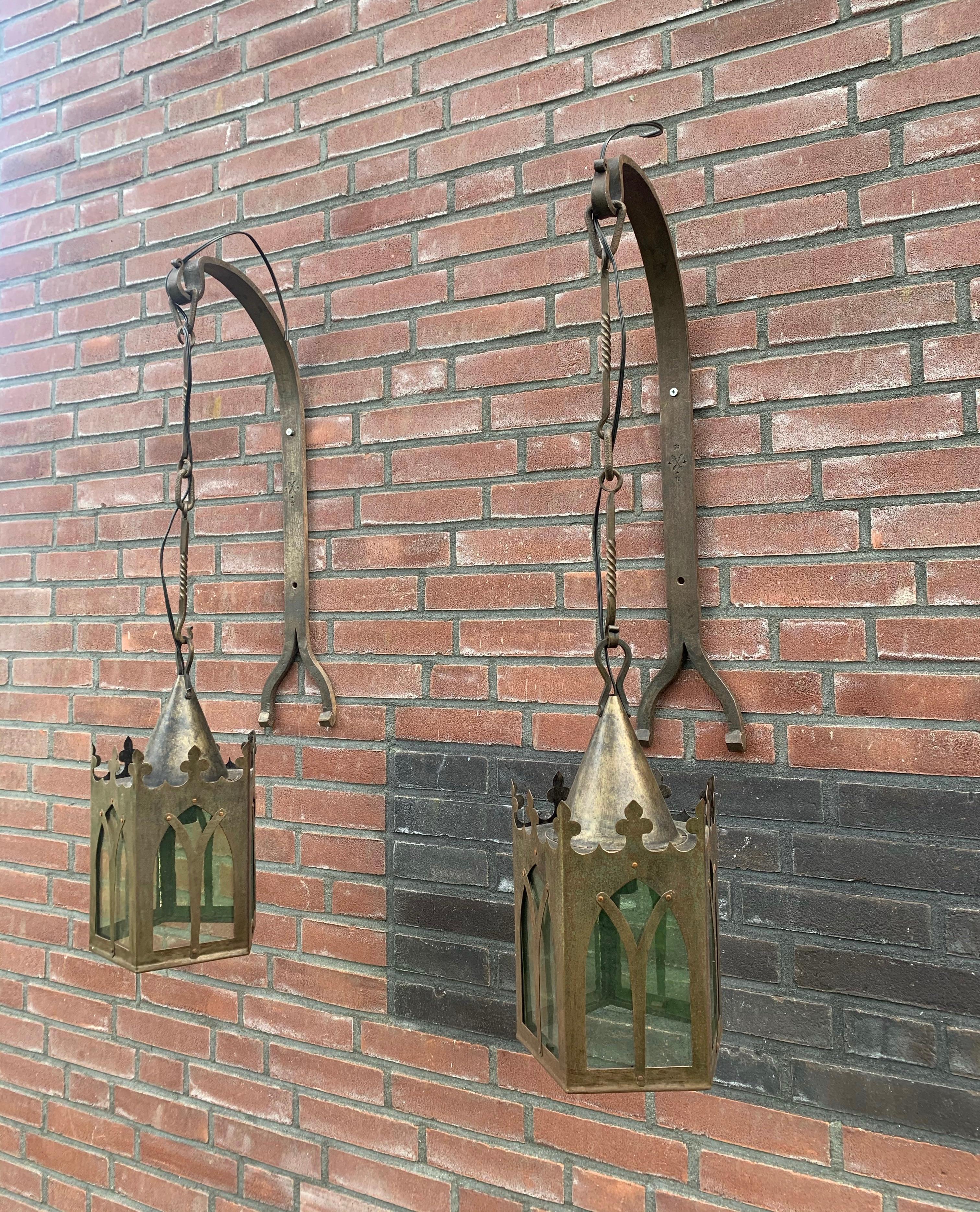 All handcrafted, Gothic style pentagonal wall lights with brackets.

This early 20th century pair of marked brackets with pentagonal lanterns is all handcrafted, completely original and in very good condition. The natural wear has made this Medieval