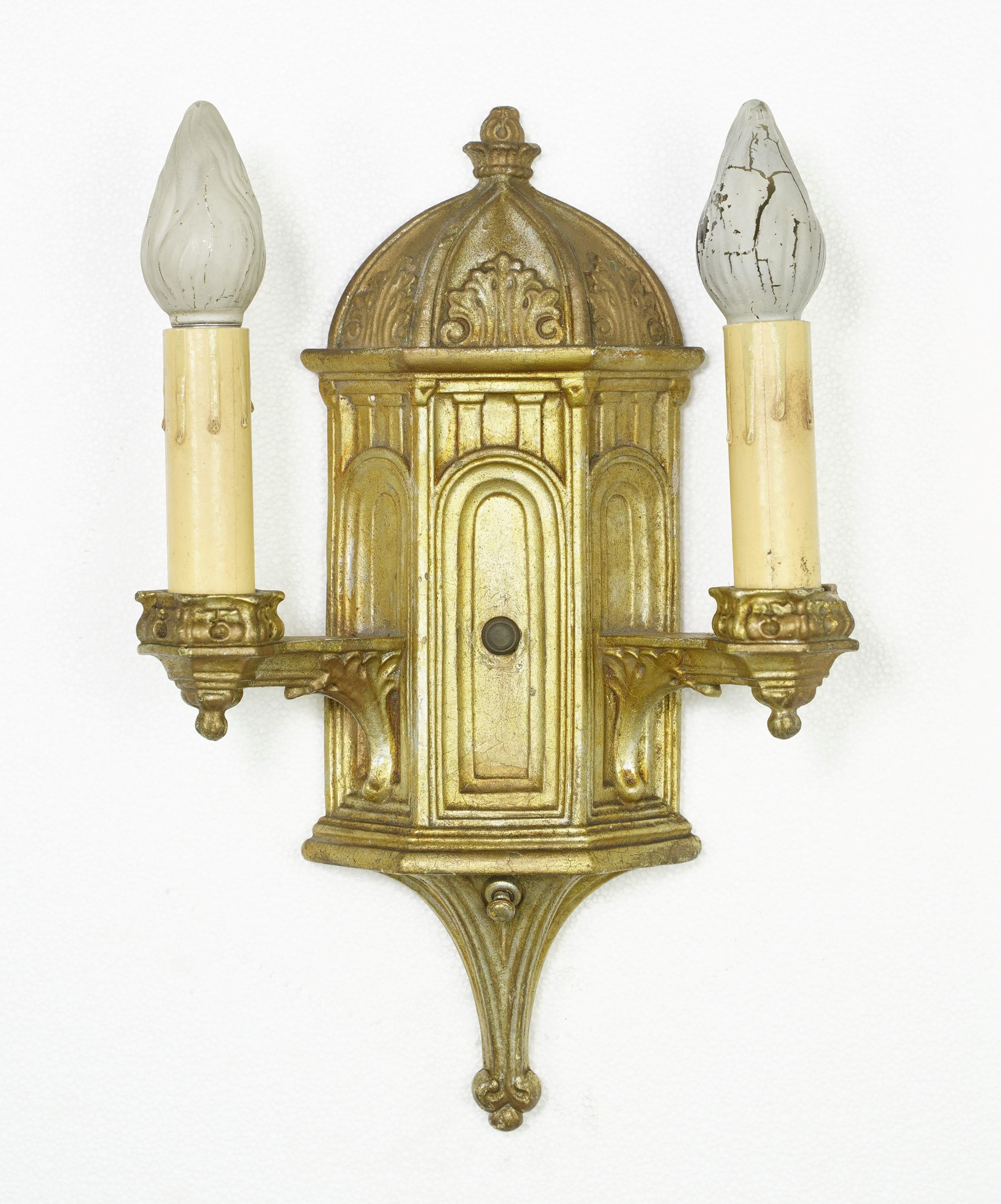 Early 20th Century pair of two light gold Gothic style sconces made out of plaster. Takes two standard Edison base sockets. Cleaned and restored. The area around the sockets has minor cracks & chips and the plaster has minor chipping. Please see