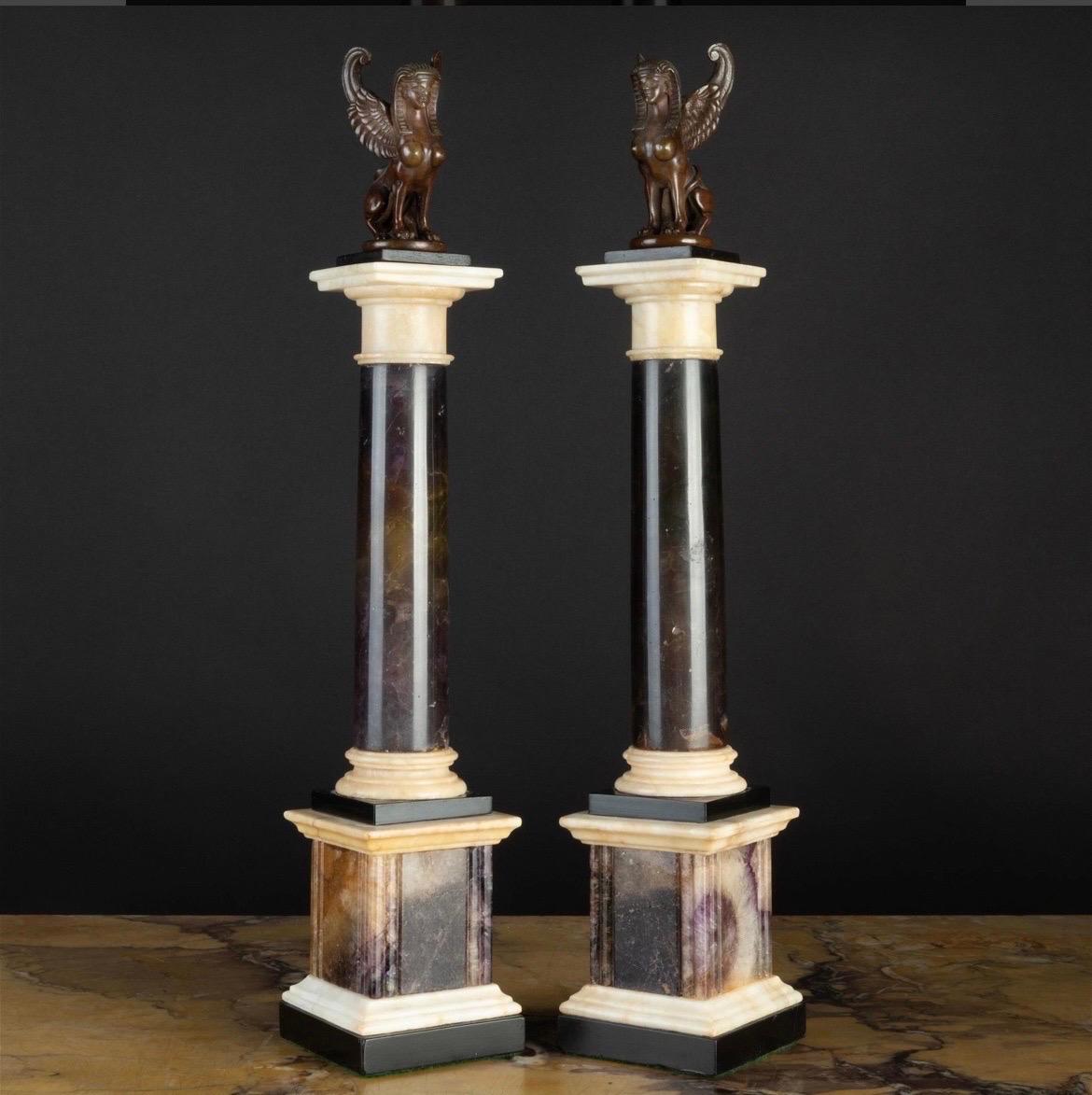 English, 19th century.


An exceptional and rare pair of Grand Tour period Neoclassical columns. Each column has a stepped bronze and white marble plinth and base that is separated by a carved Blue John pedestal which all support a solid Blue John