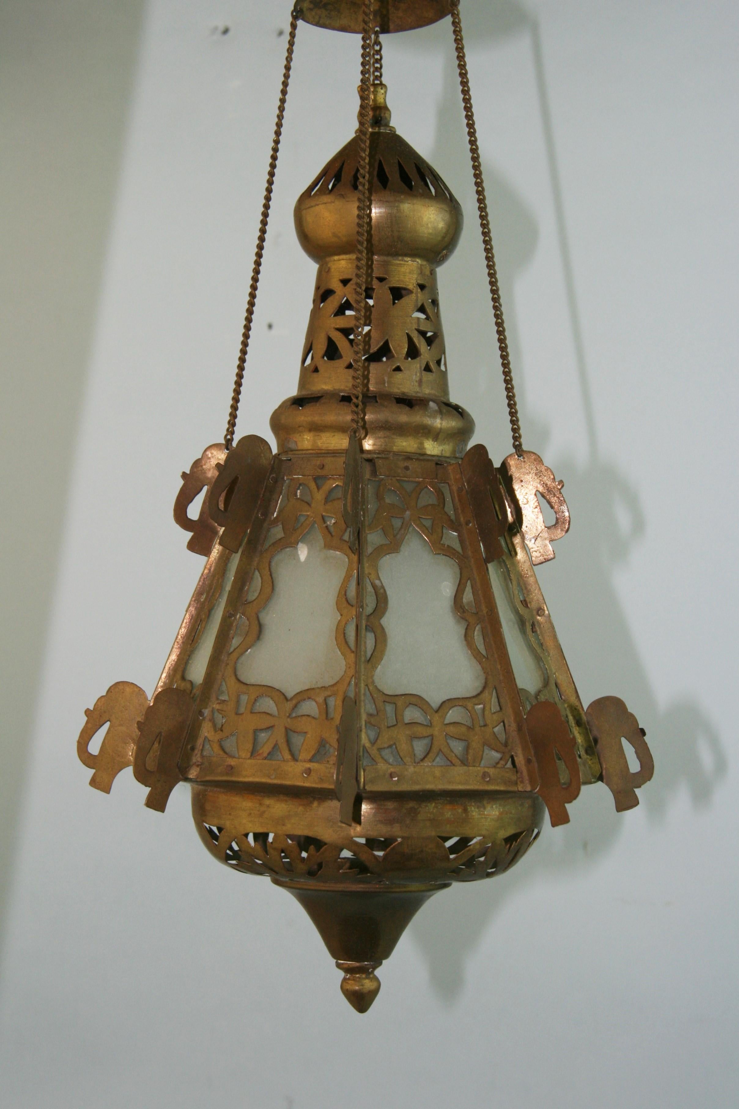 1219 Pair of hand crafted Greek church offering lanterns with intricate detailing.