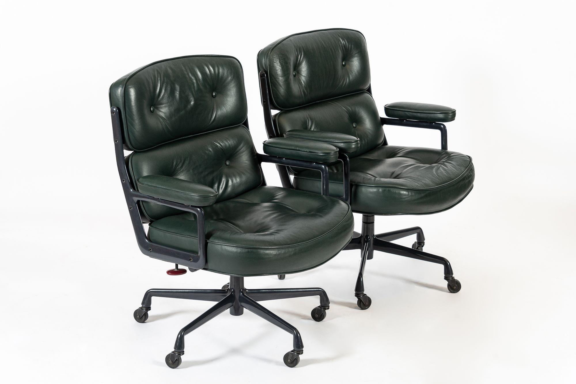This pair of vintage mid century modern green Model 3475 Eames Time Life Lobby Chairs designed by Charles & Ray Eames for Herman Miller were manufactured in 1996. These classic office chairs feature beautiful green leather upholstery and charcoal