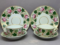 Pair Green Pink and Gilt Grape Leaf and Rose Cups and Saucers