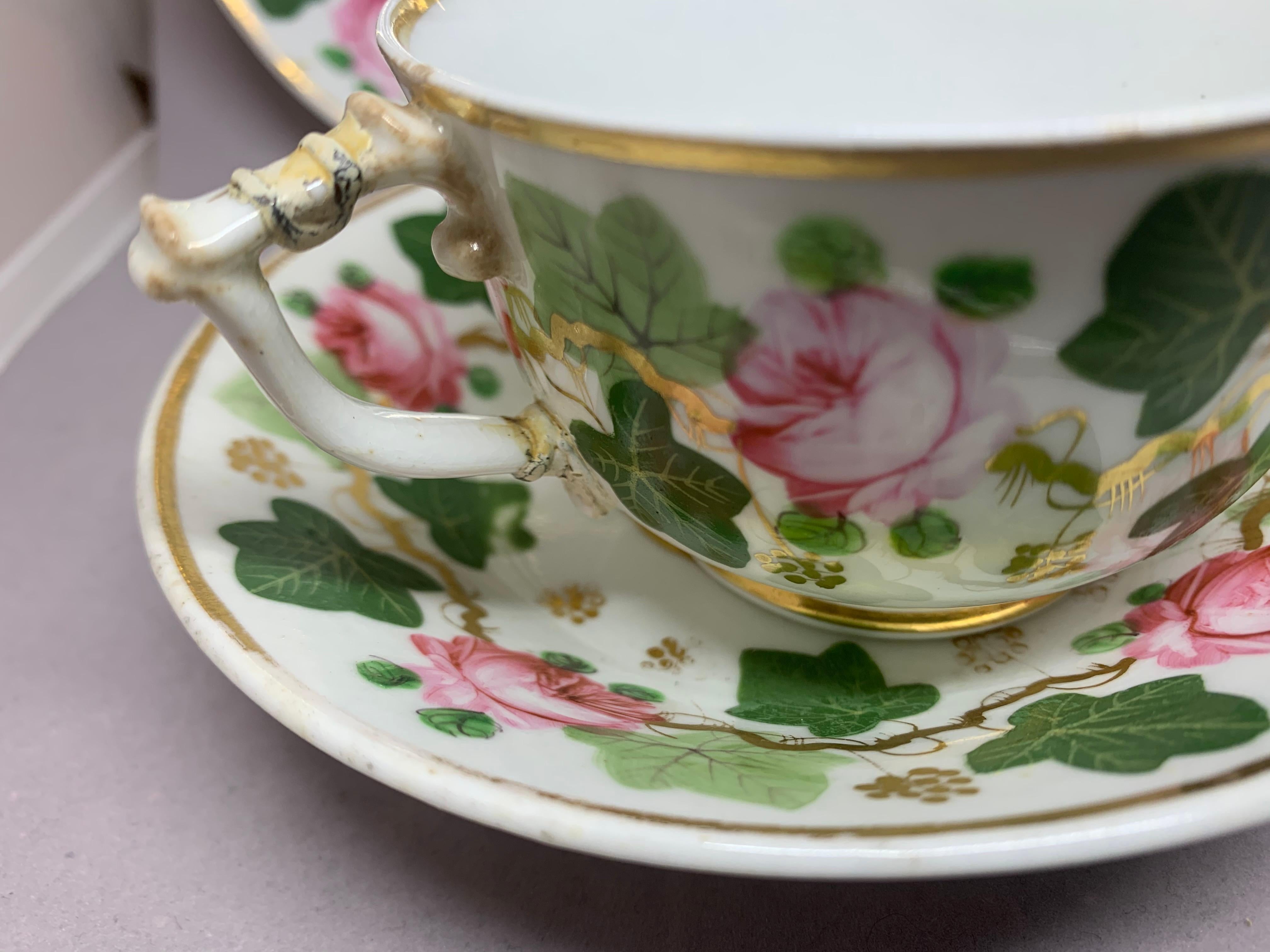 Hand-Painted Pair Green Pink and Gilt Grape Leaf and Rose Cups and Saucers For Sale