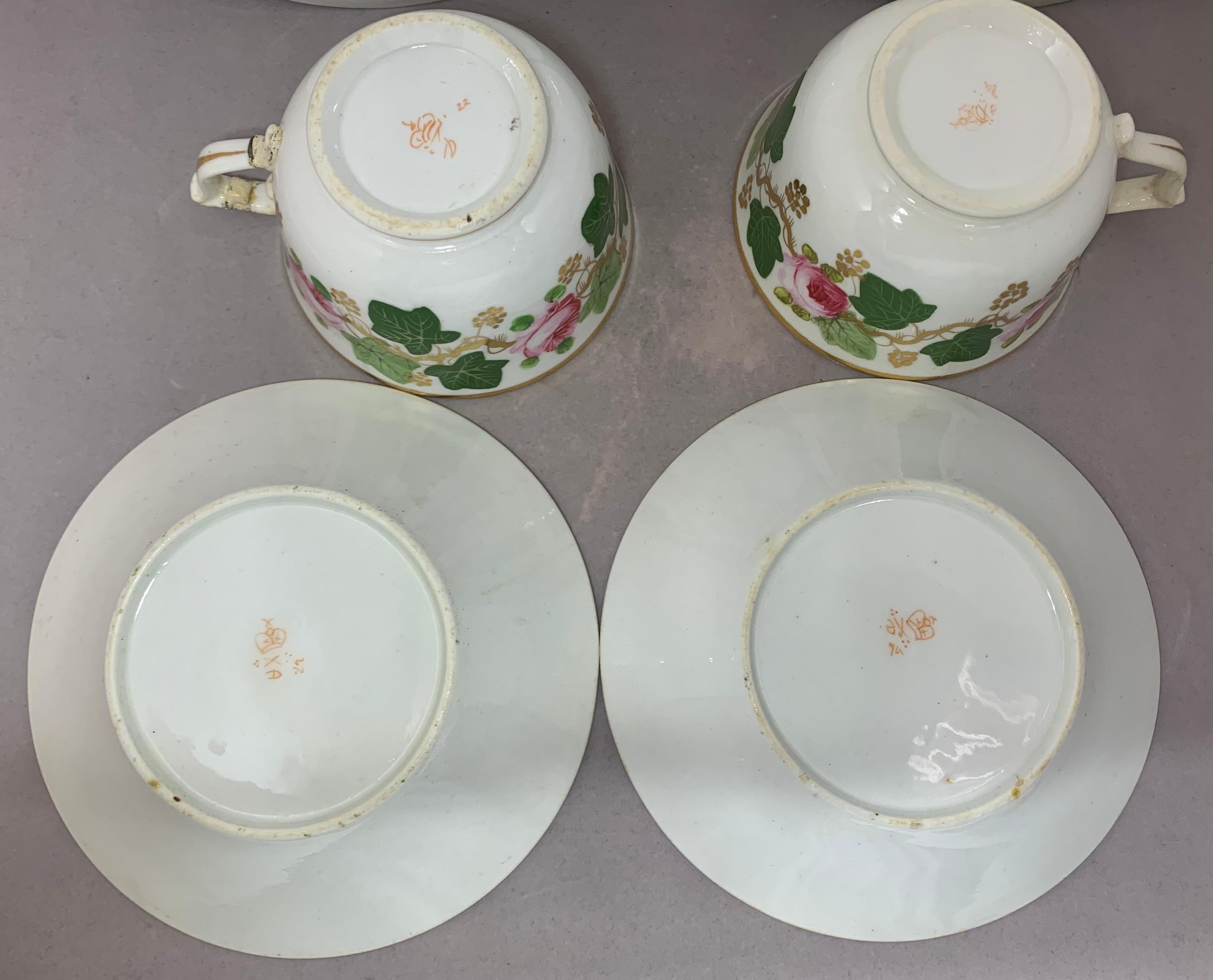 Porcelain Pair Green Pink and Gilt Grape Leaf and Rose Cups and Saucers For Sale