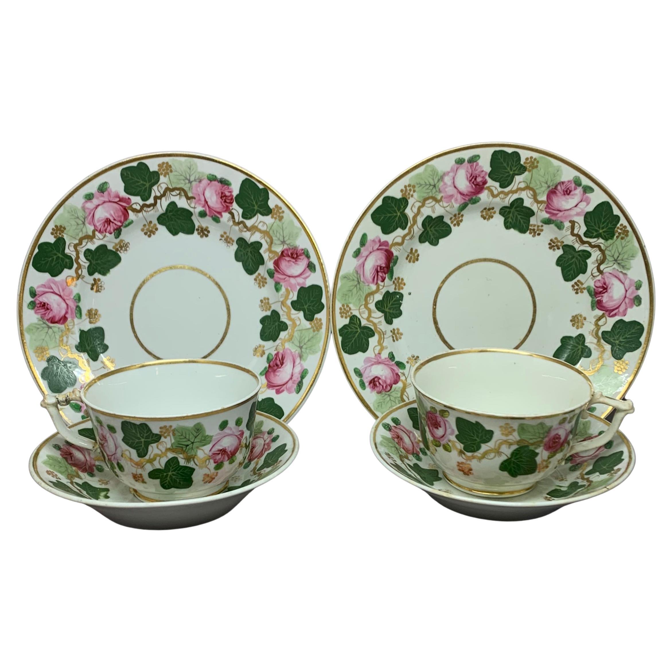 Pair Green Pink and Gilt Grape Leaf and Rose Cups and Saucers