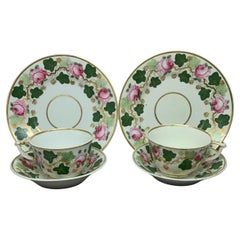Pair Green Pink and Gilt Grape Leaf and Rose Cups and Saucers