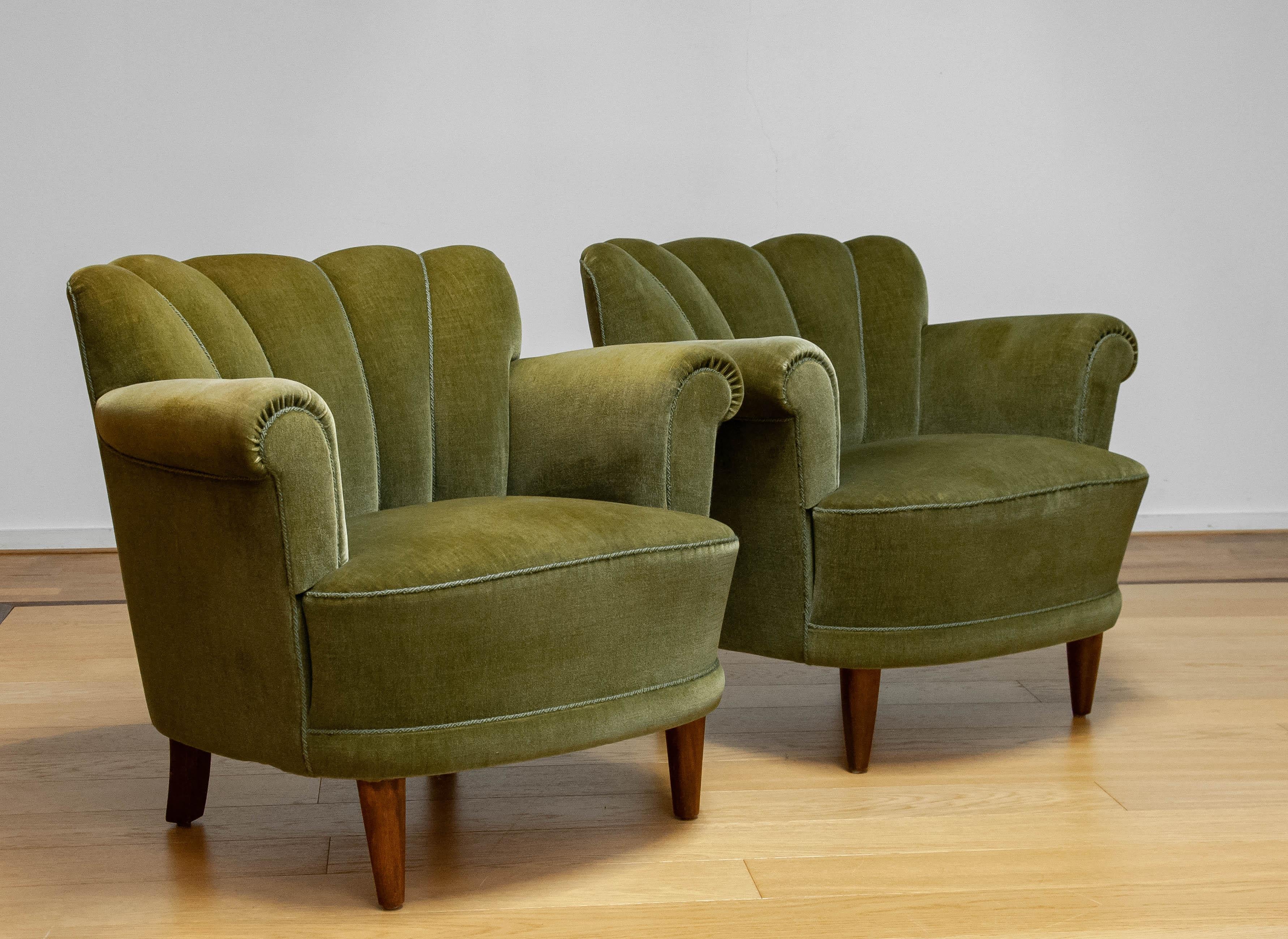 Pair absolutely beautiful and high quality easy / lounge chairs attributed to Carl-Johan Boman for Oy N. Boman AB Finland. These chais are stil in their original condition and both are in good condition. 
Both sit and support very good.


