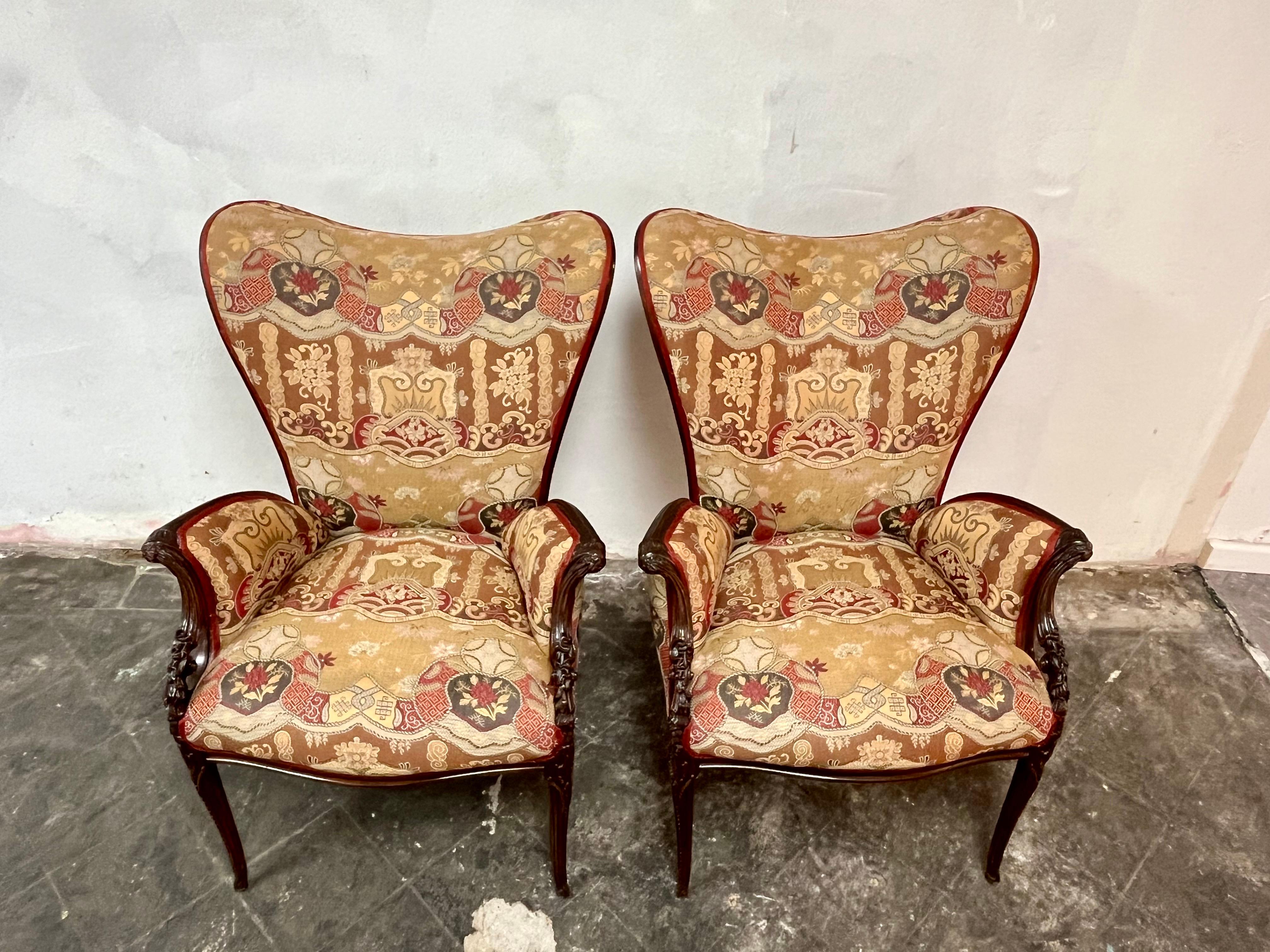Stunning pair of Grosfeld House attributed to well carved mahogany armchairs. We love the wonderful heart shaped back with the swooping flared ornate arms-very stylish. Lovely upholstery in great shape. 
Curbside to NYC/Philly $400