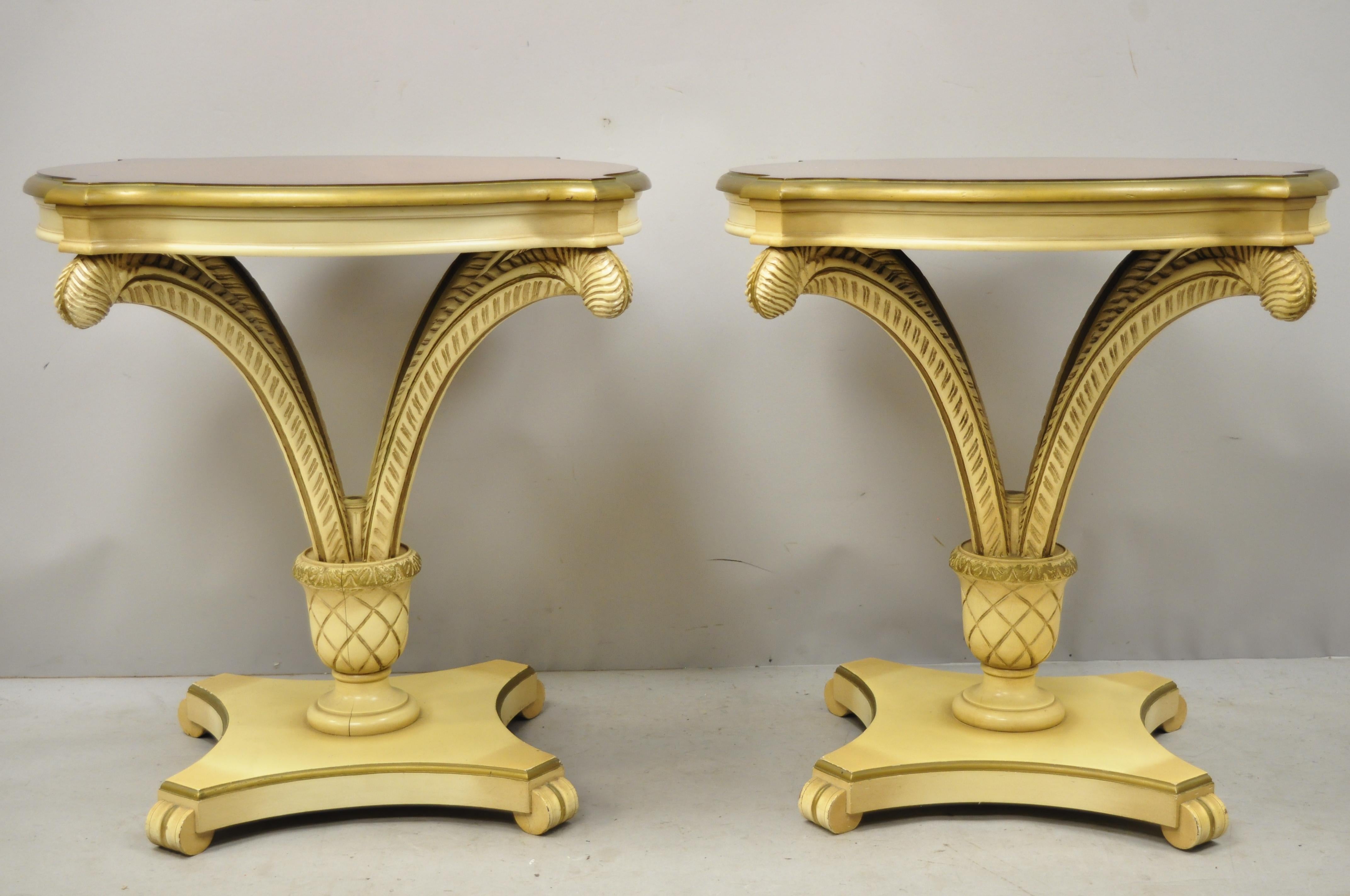 Pair of vintage Grosfeld House plume carved feather pedestal Regency end side tables. Item features a pineapple carved pedestal, plume feather carvings, beautiful wood grain, great style and form, circa mid-20th century. Measurements: 27.5