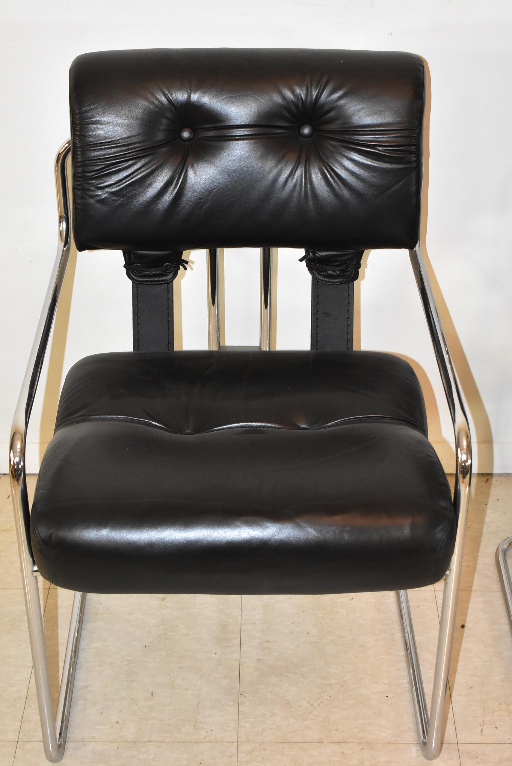 Pair of black leather and chrome side chairs by Guido Faleschini for Mariani. Stamped Made In Italy on the frame. Very nice condition. 