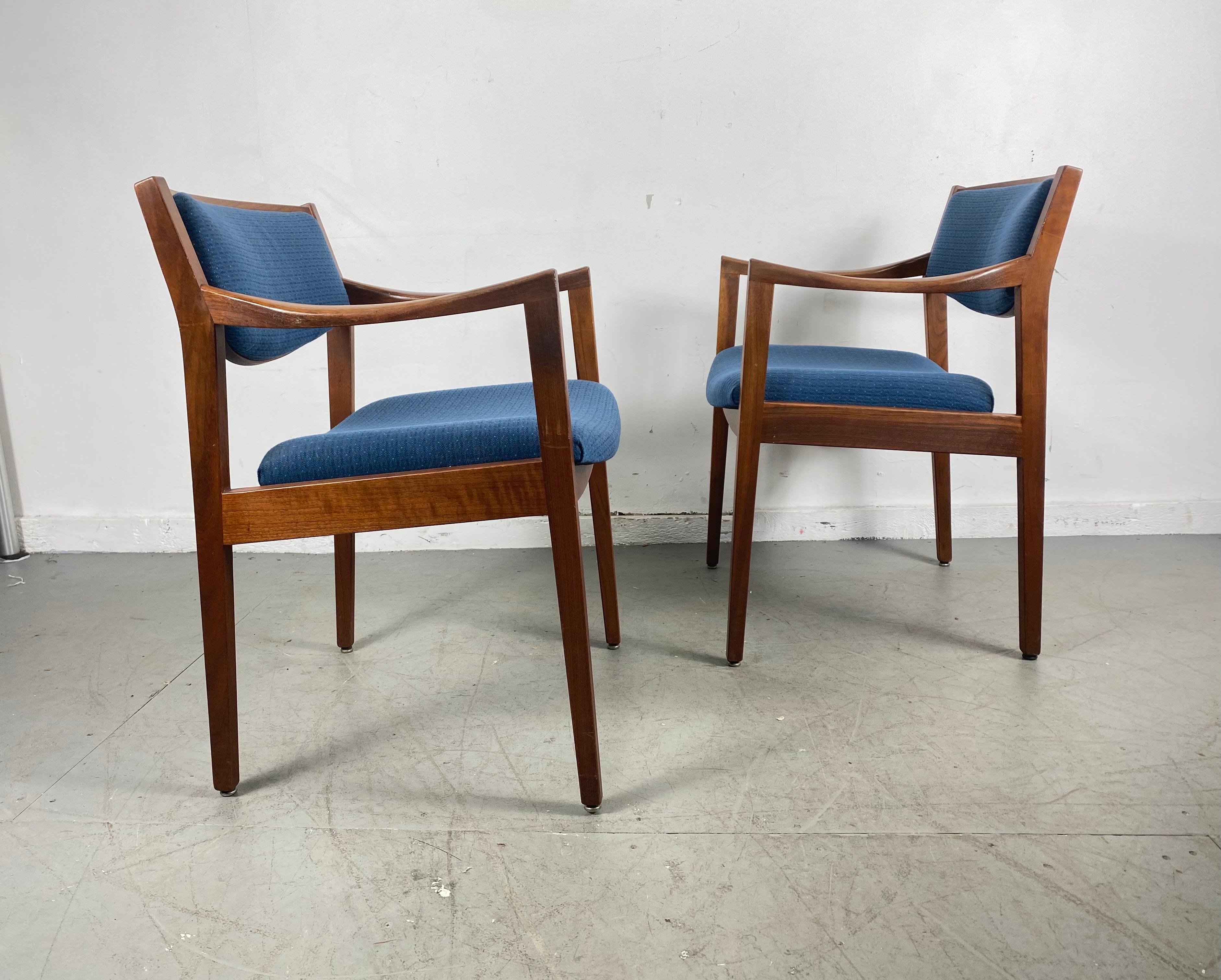Pair of Gunlocke modernist sculpted walnut and fabric occasional armchairs, in the style of Jens Risom, Classic Mid-Century Modern design, extremely comfortable, reupholstered (at some point) in a blue wool fabric.