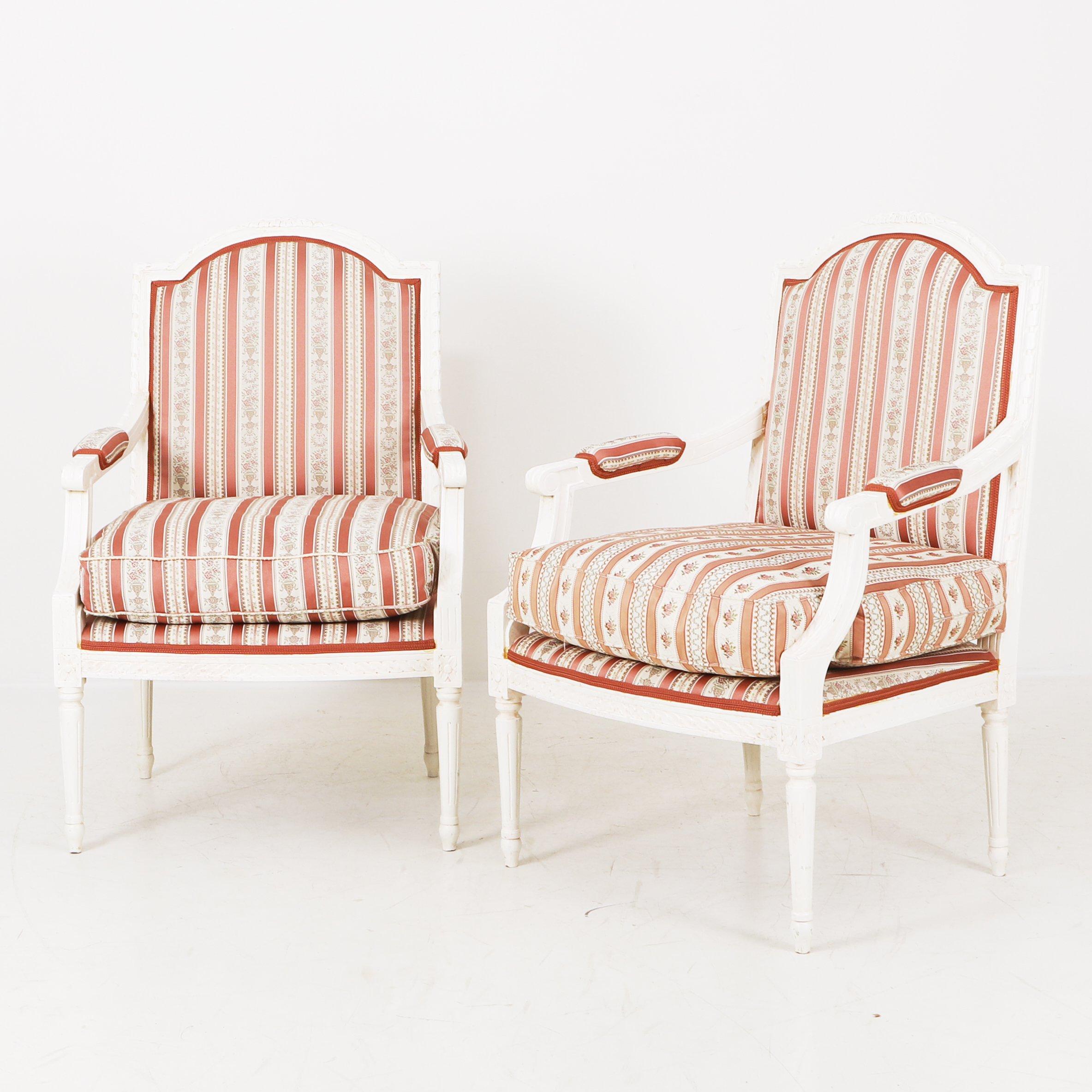 Add a touch of regal flair to your home with this pristine pair of painted Gustavian armchairs from the second half of the 1900s. You’ll love the stunningly gorgeous red-and-rose striped silk upholstery. Features upholstered seat with loose cushion.