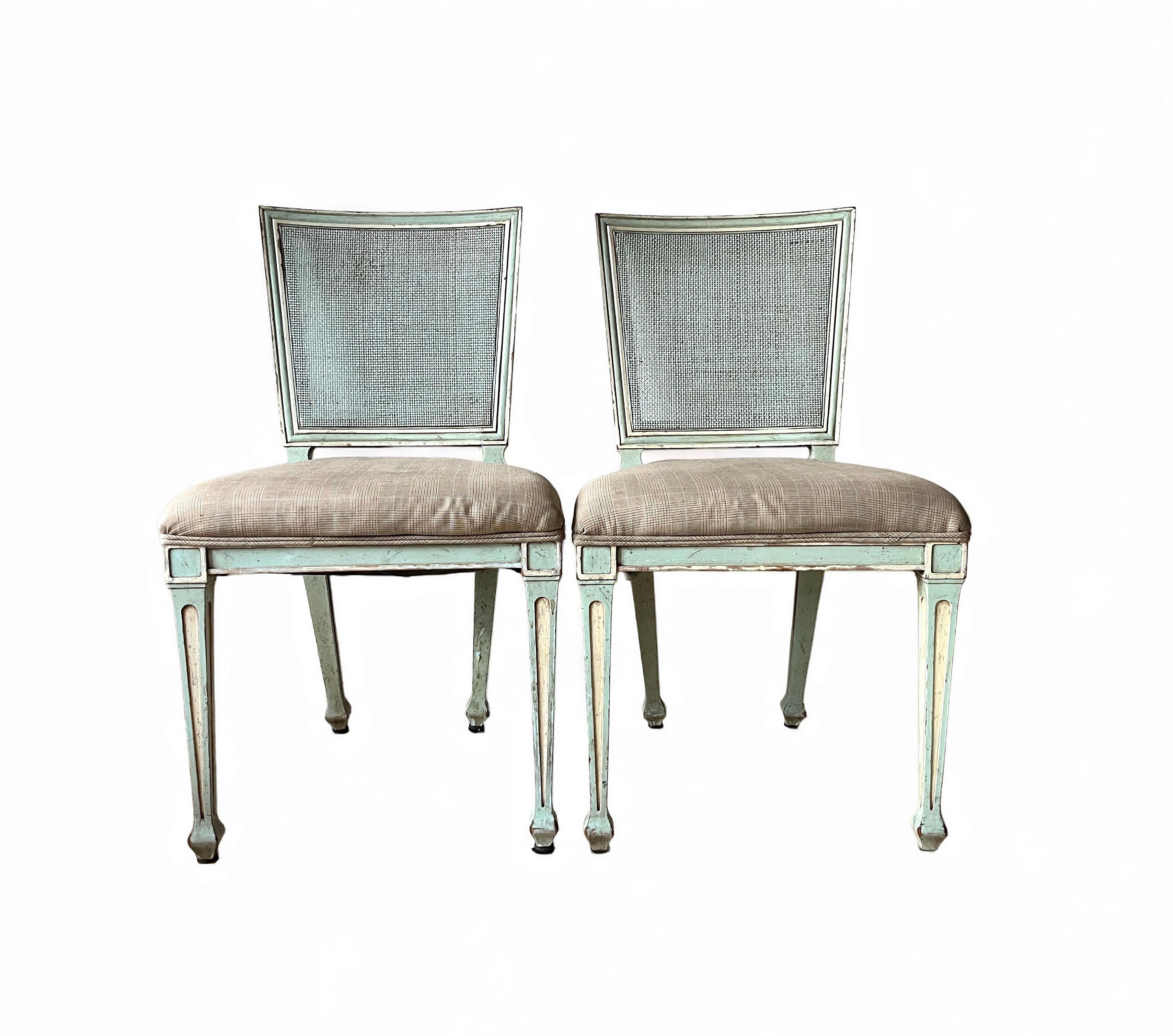 A beautiful pair of Gustavian style painted wood, square-back cane and upholstered side chairs by John Widdicomb Co. of Grand Rapids, Michigan.

USA, Circa 1950s

Solid sculpted wood frames, with caned seat backs and upholstered seats in a brown and