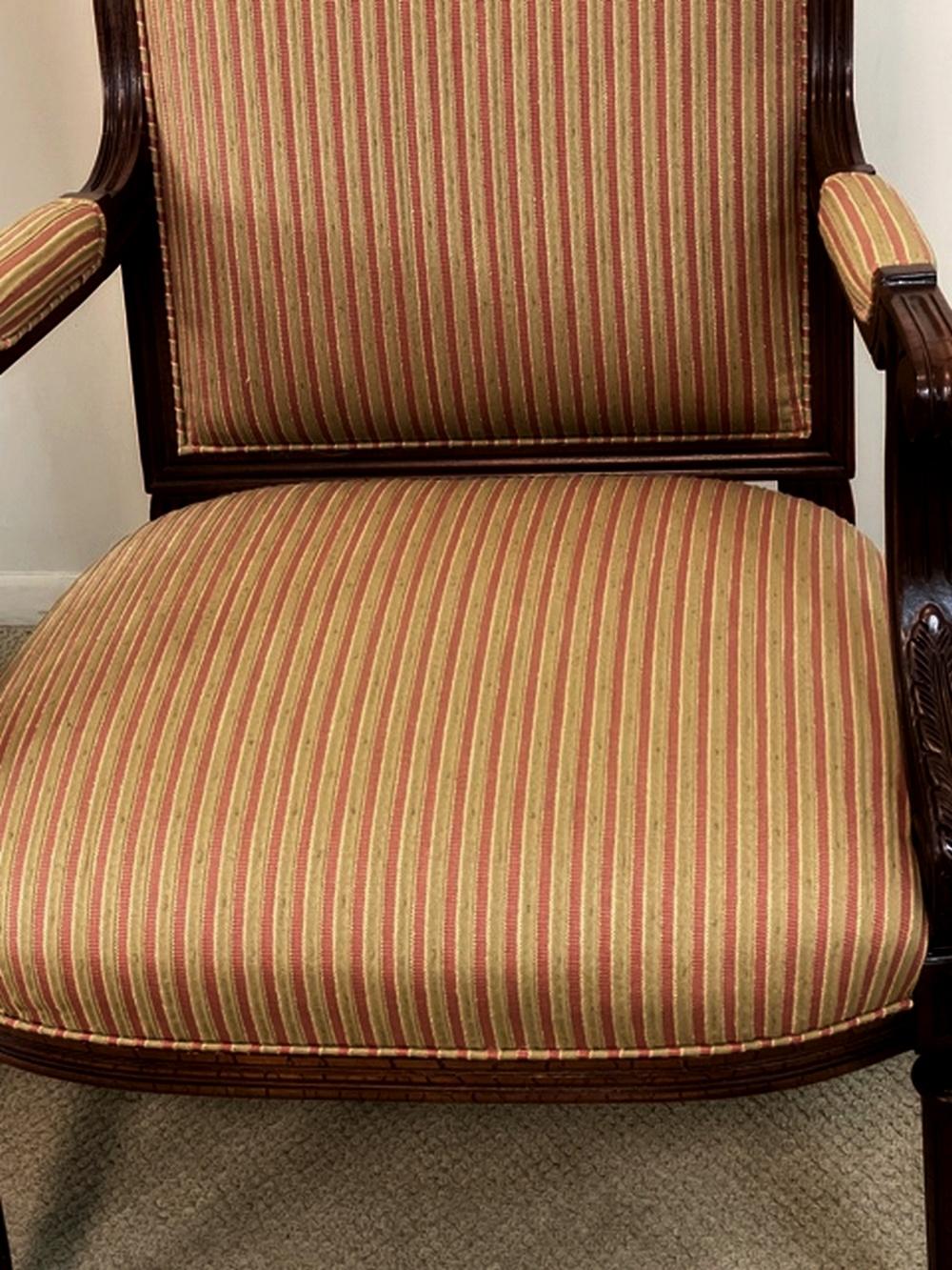 Pair of Regency style chairs by Hancock & Moore. Carved hardwood frames with a crackle finish in very nice condition. Gold and rose striped fabric. Dimensions: 21