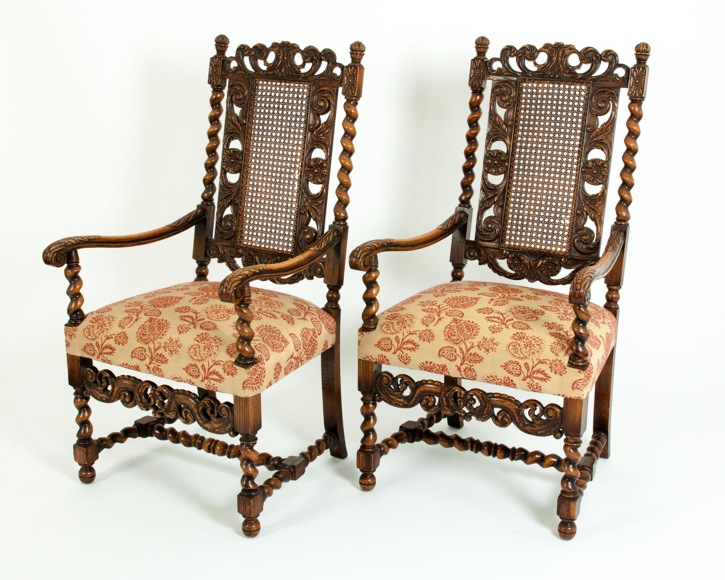 Late 19th century Renaissance Revival hand carved walnut with back cane armchairs / corner chairs. Each armchair features a tall back ornate spiral carved barley twist walnut frame with scroll work. Very impressive hand carved chair with remarkable