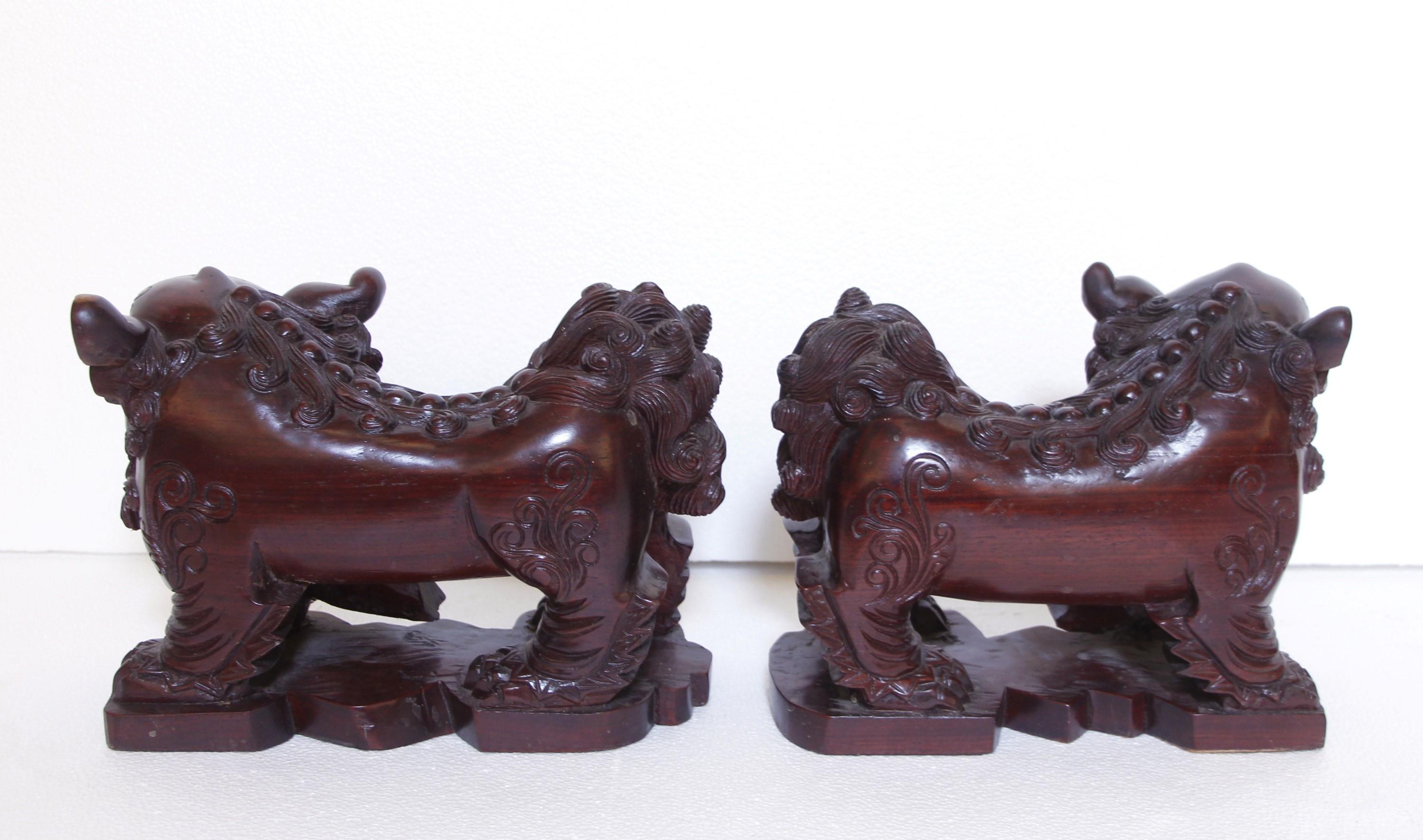 Contemporary Pair Hand Carved Wood Cambodian Foo Dogs For Sale