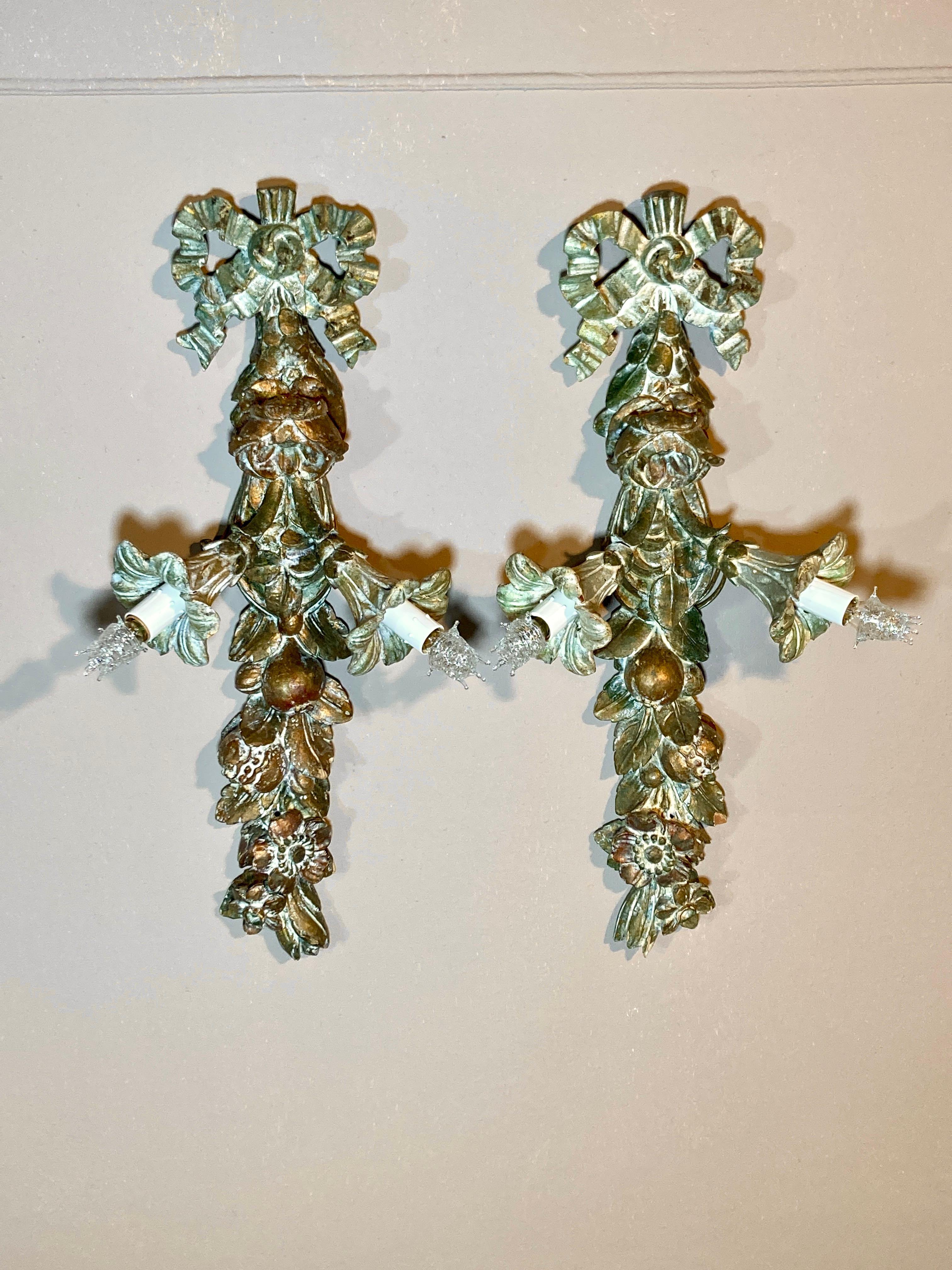 Found in the collection of a well-traveled architect in Connecticut, these fine hand carved Italian wall sconces are top quality. The unusual form, with the downward pointing lights, is complemented by the original surface, consisting of a