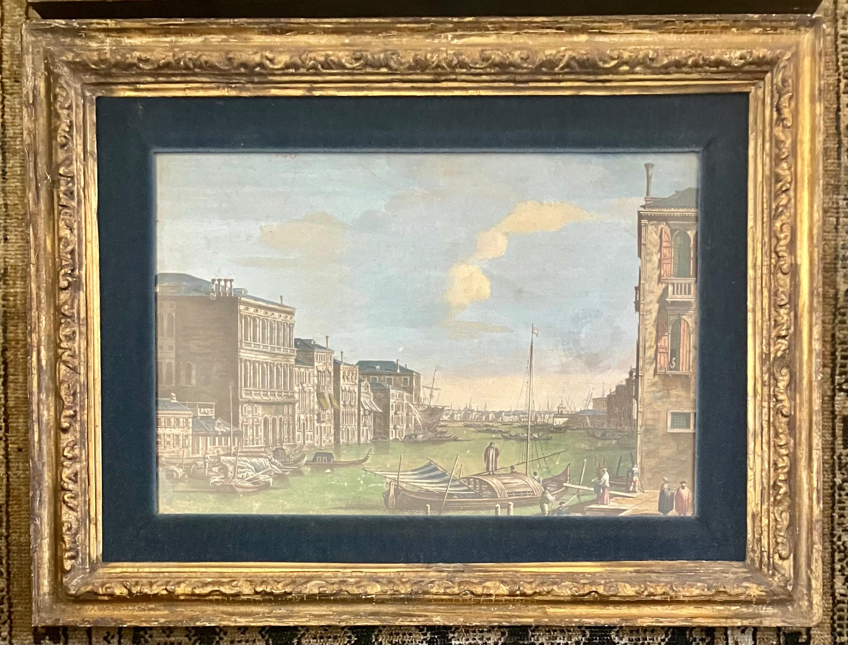 Pair hand-colored Venetian engravings after Canaletto.  18th century hand-colored Venetian engravings in period gilt frames after Canaletto (1697-1768) with view of the Grand Canal towards the Custom Point from Campo San Vio and Piazza St. Marco