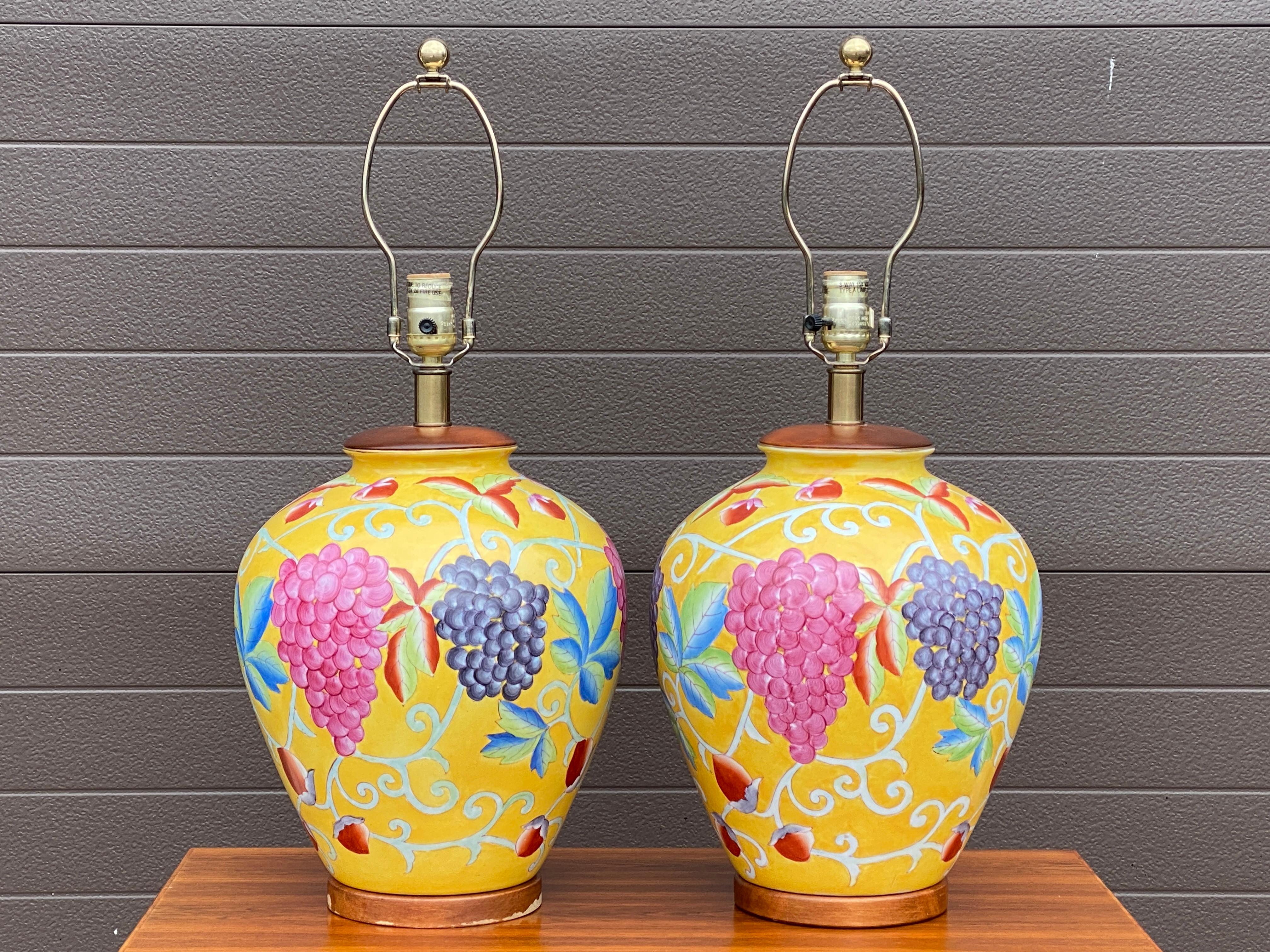 A quality pair of table lamps by Tyndale of Chicago featuring hand painted fruit motifs.

18” tall to top of bulb socket