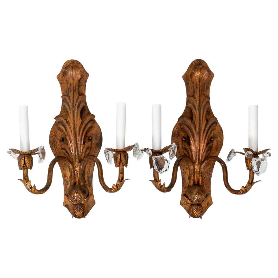 Pair handmade gilt iron sconces. Two Arms each. Hand wrought iron with cut metal details with gilt finish. Some patina to finish. Rewired, ready to use. Measures 15