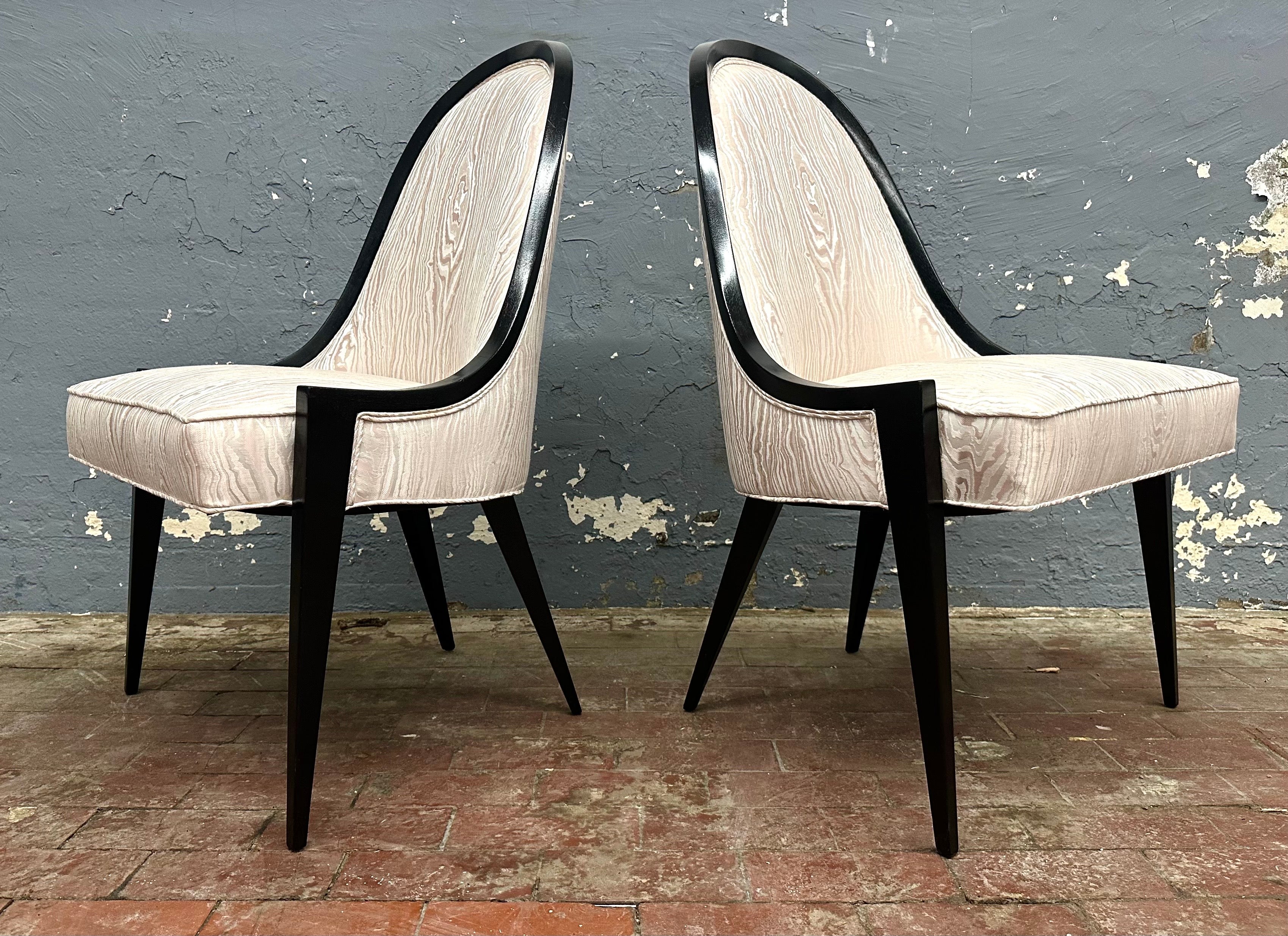 Wonderful chair design with a sleek tapered profile. The dark stained mahogany frame is upholstered in an elegant cream Faux Bois Moire weave silk jacquard by Schumacher.