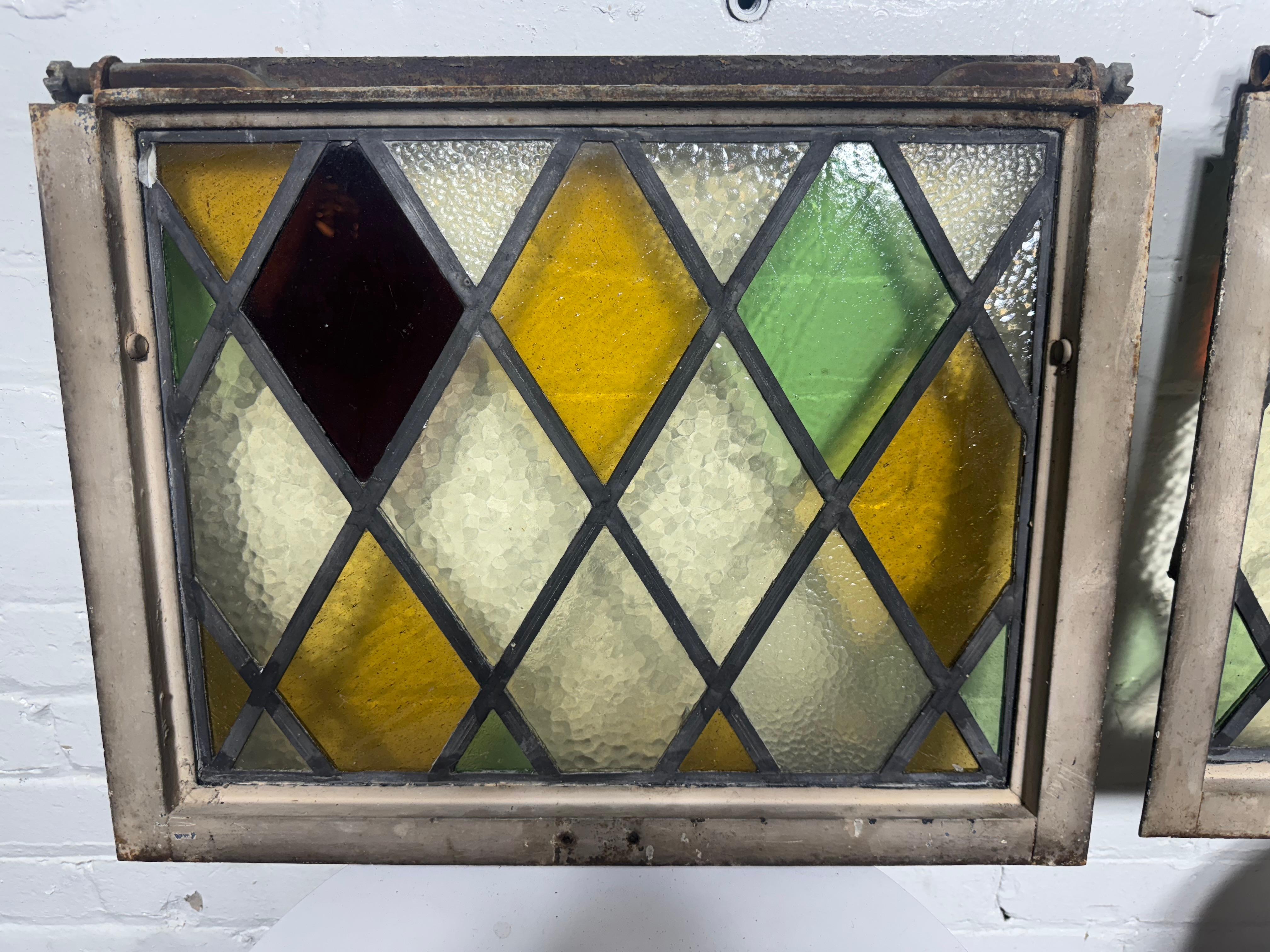 Early 20th Century Pair Heavy Cast Iron Frame Tudor Style Diamond Stained Glass Windows For Sale