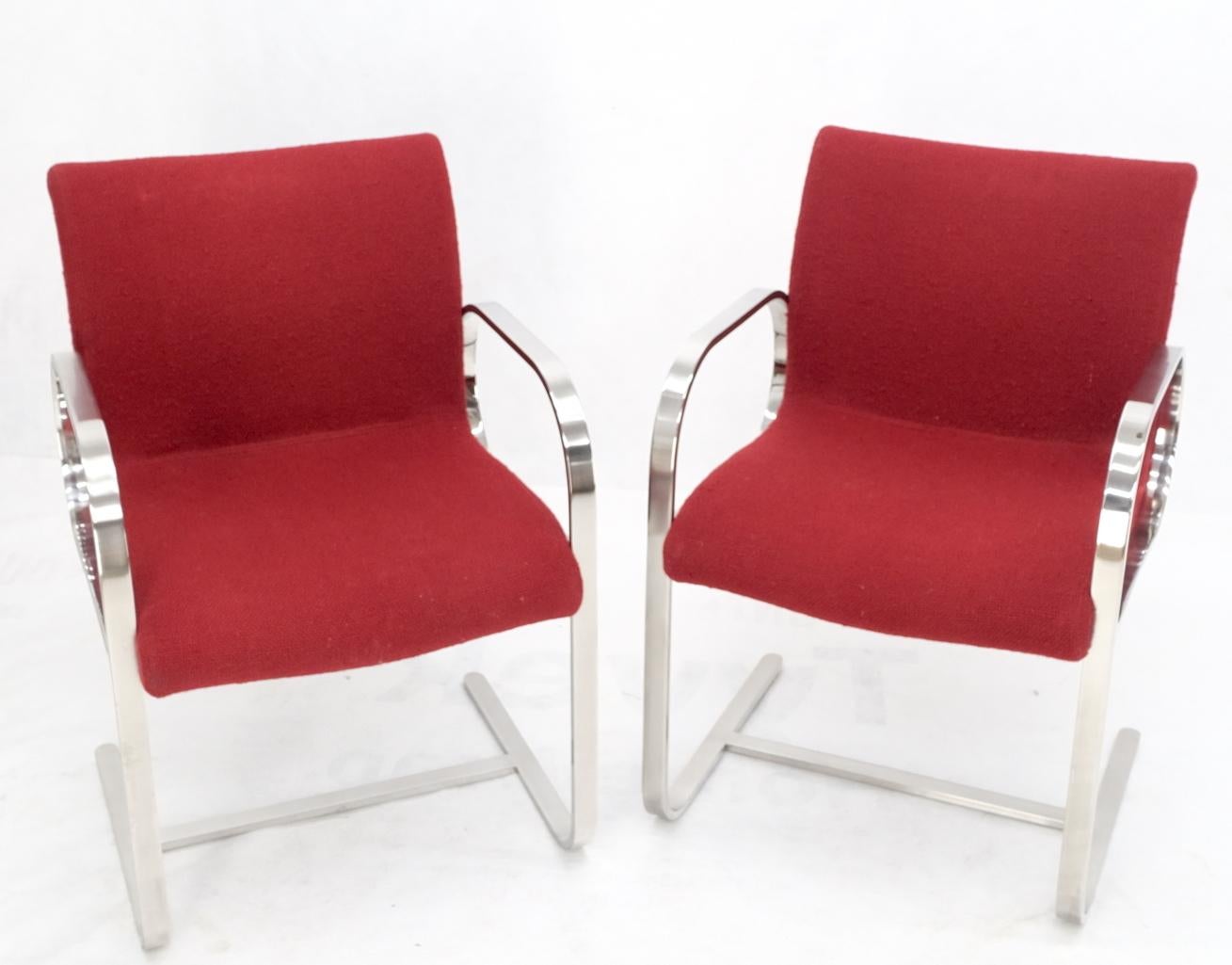 Pair heavy solid stainless steel formed bend frame side lounge chairs red upholstery.
Super high quality metal work bending welding and polishing of stainless steel. Bauhaus Le Corbusier, Mies Van Der Rohe decor match.
