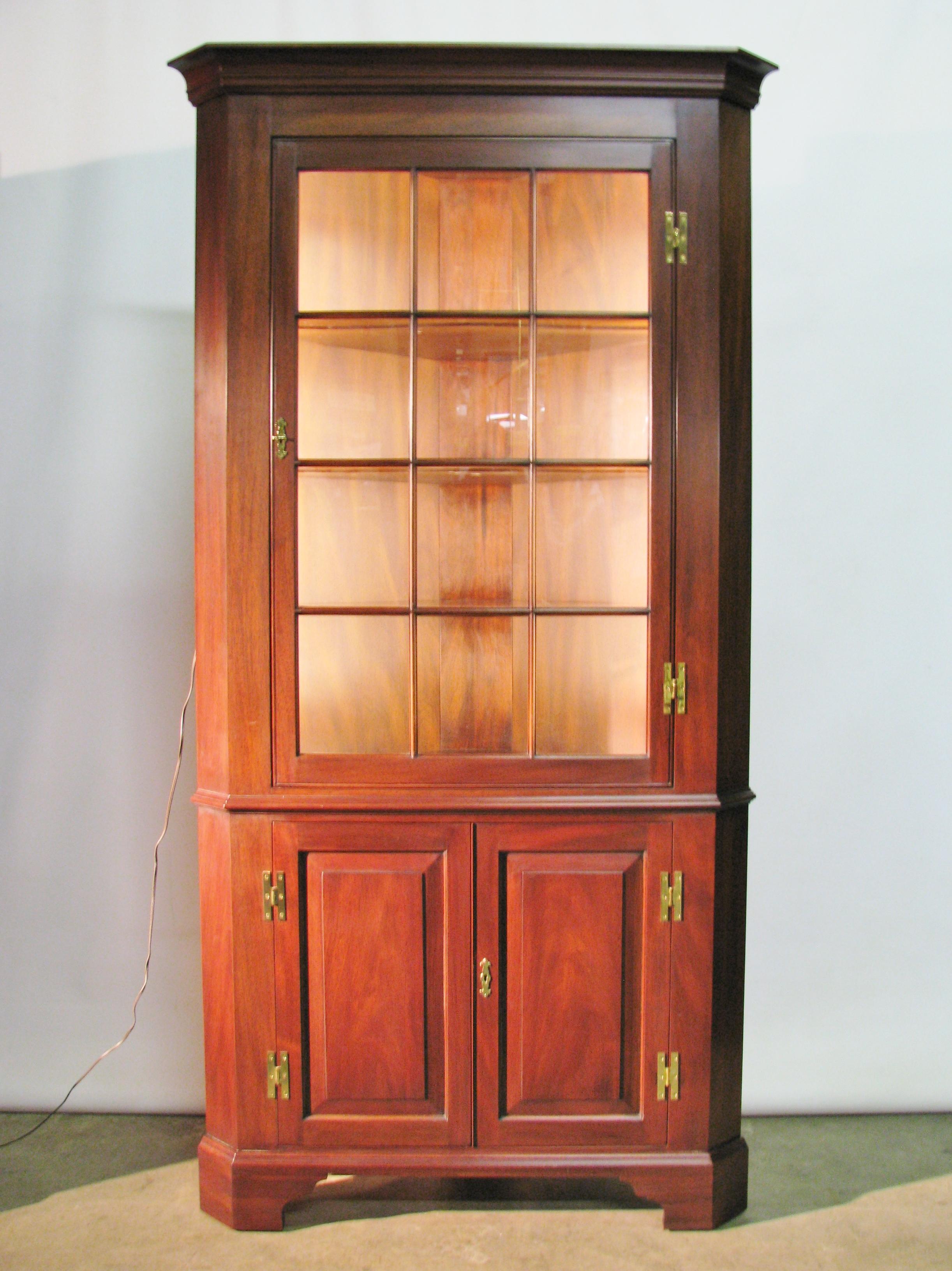 Pair of exceptional, solid mahogany Federal style corner cabinets by Henkel-Harris from their 