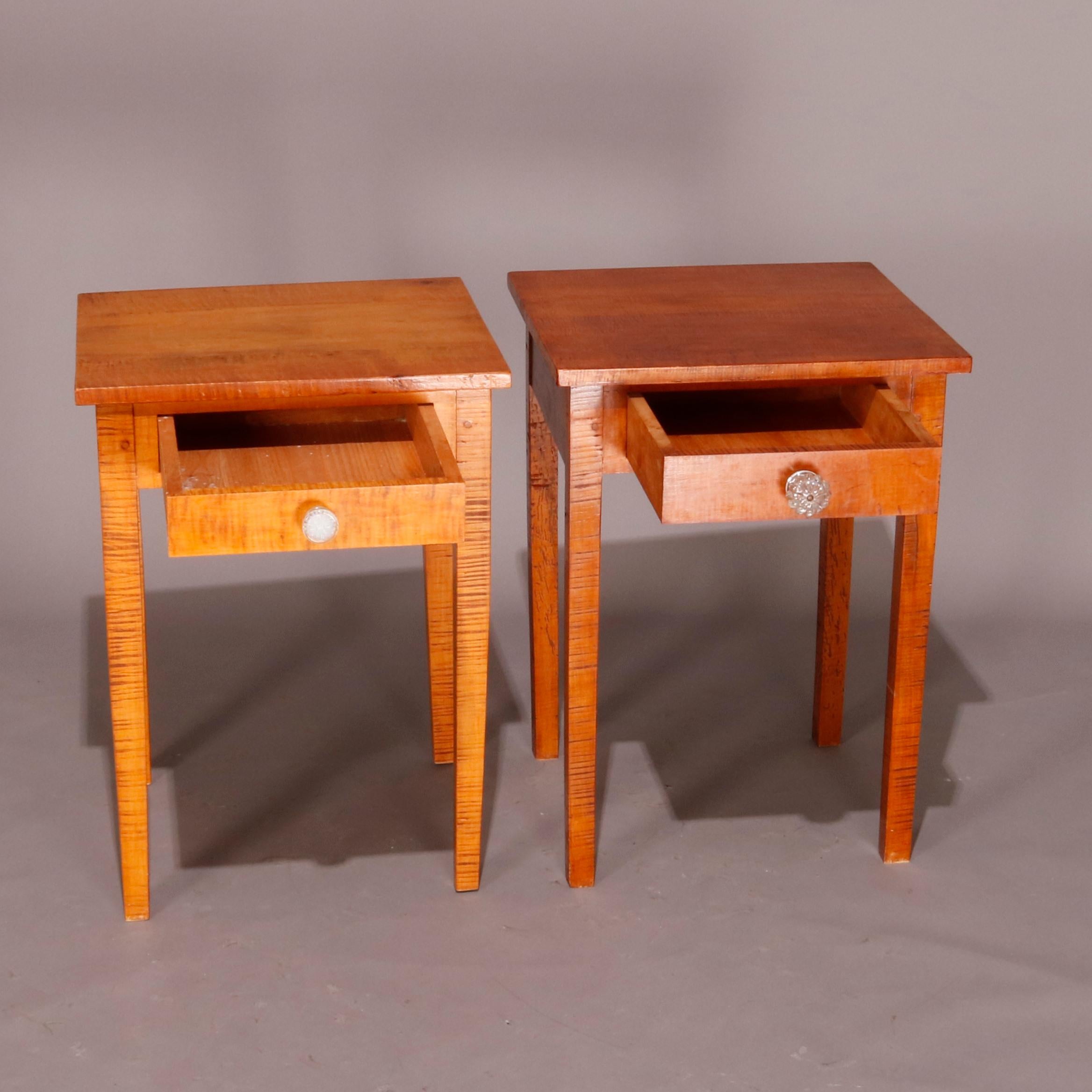 A pair of Hepplewhite style end stands offer tiger maple construction with case having single drawer and raised on square and tapered legs, 20th century.

Measures: 29