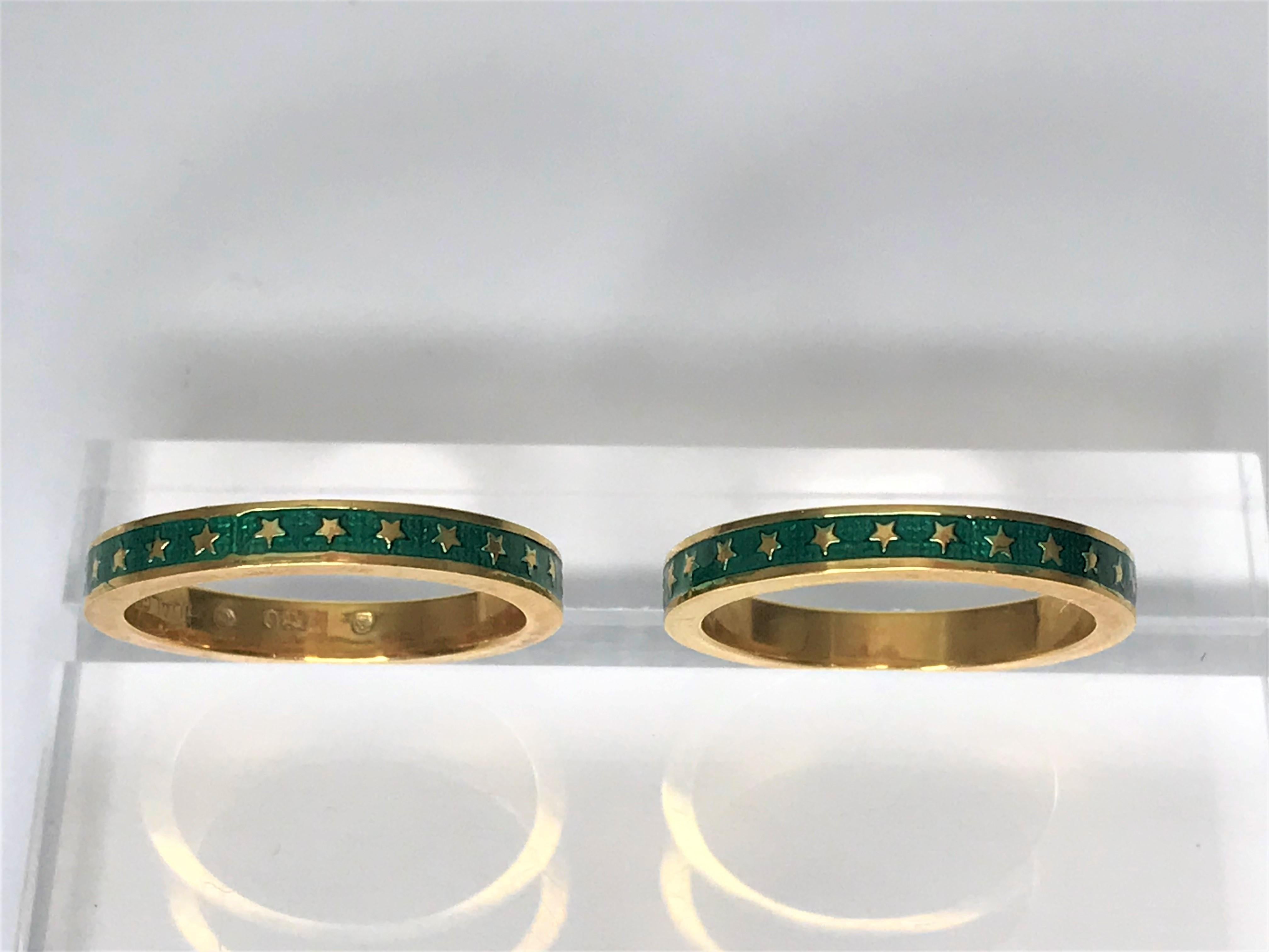 By designer Hidalgo, these bands are great on their own or stacked with other rings.
Both 3mm bands are 18 karat yellow gold
Green enamel with gold star accents
Stamped 