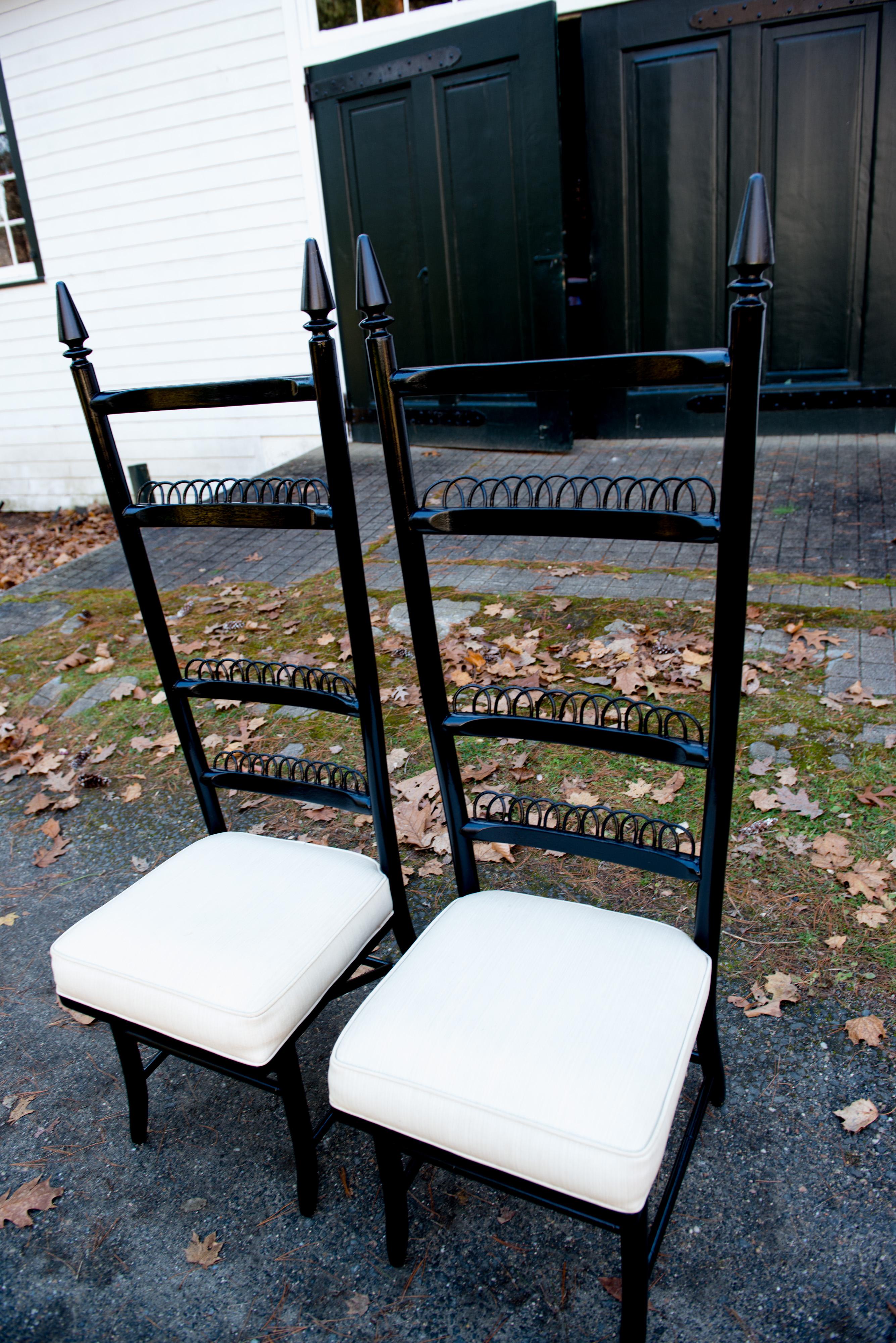 Pair of tall ladder back European side chairs. Finials are painted black as the rest of the chairs. Measures: Seat: 17.5 inches wide, 17 inches deep, 19 inches high.