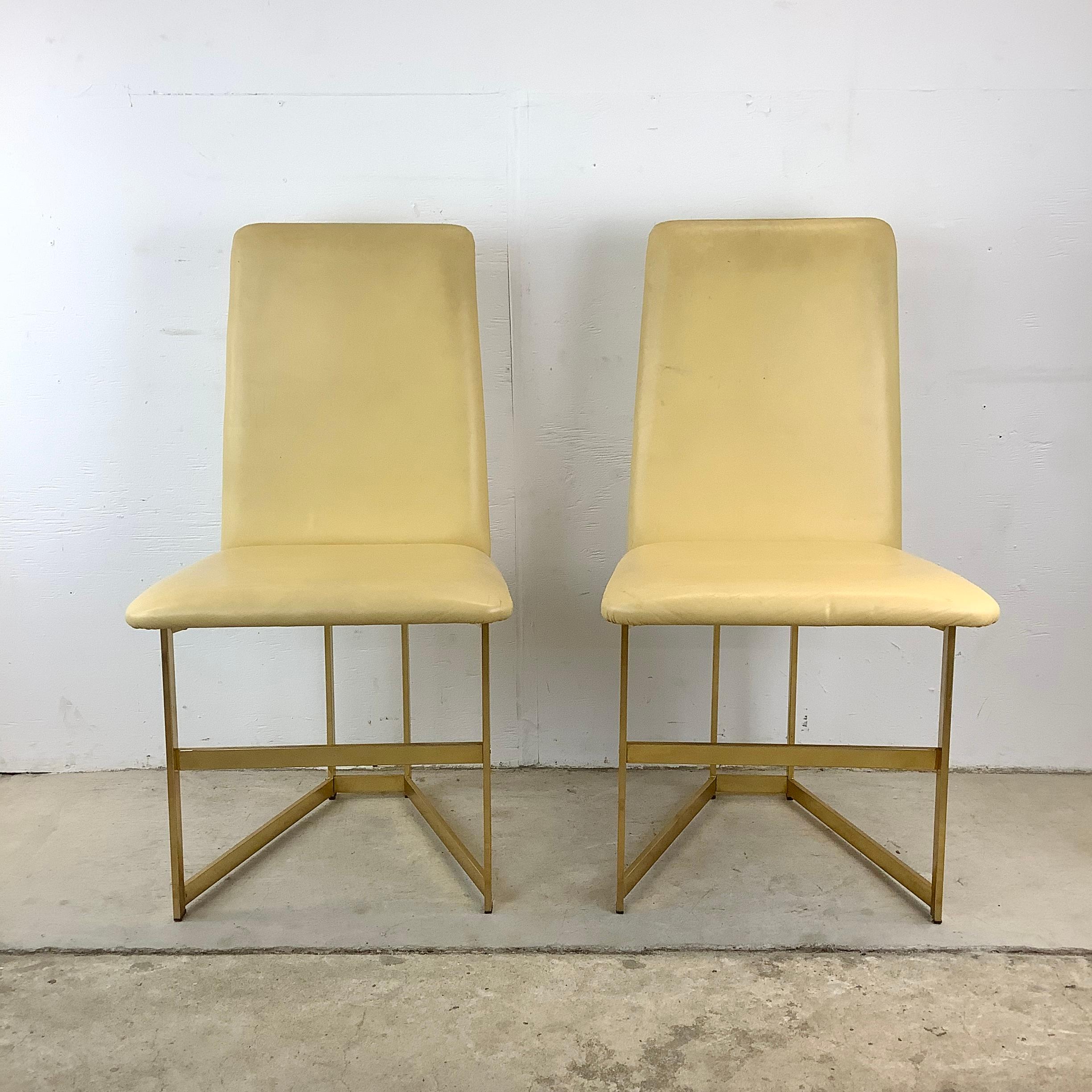 Experience the fusion of vintage elegance and contemporary design with these Mid-Century Style Highback Dining Chairs. This pair is a stunning example of modern design meeting functional art. The chairs feature a sleek, minimalist frame made from