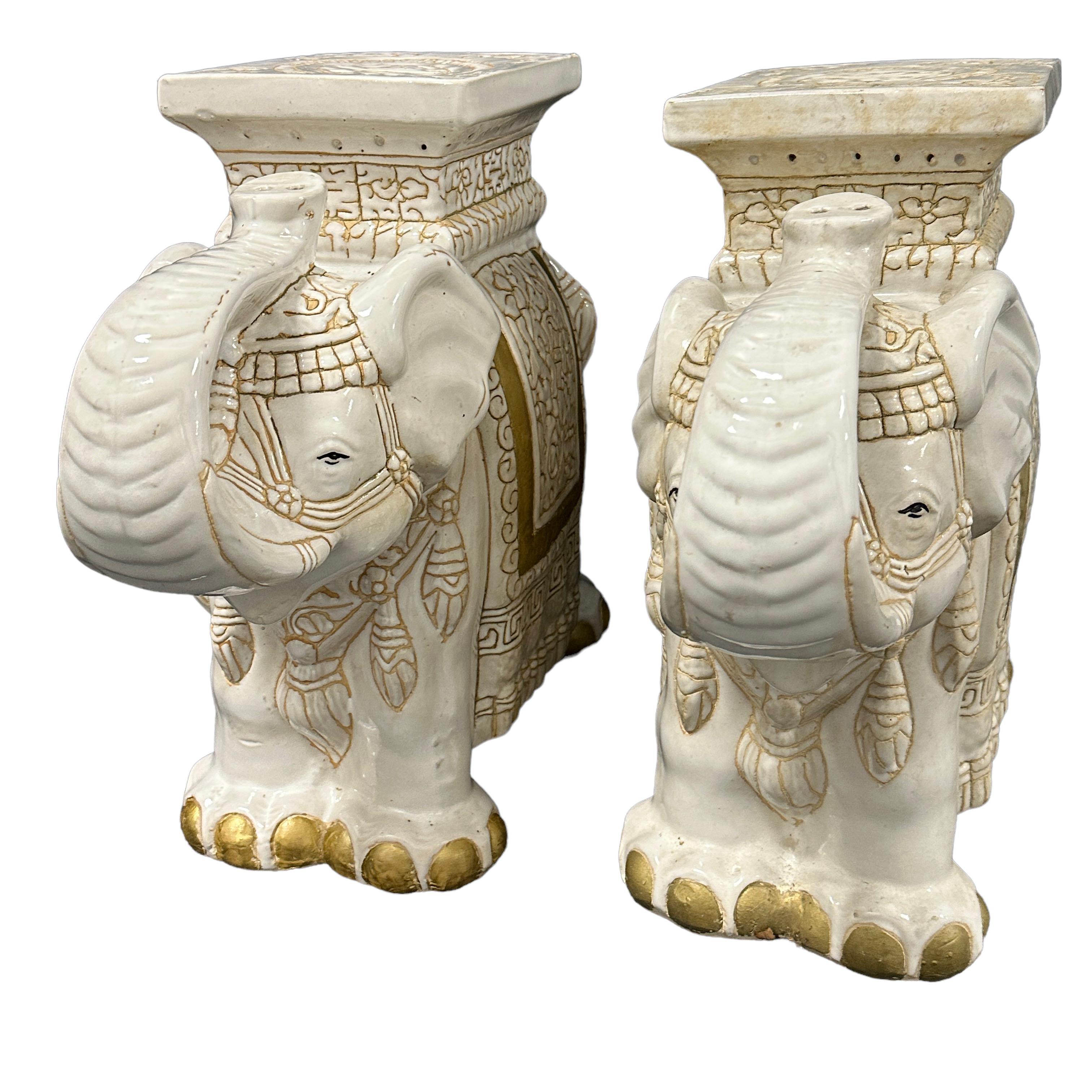 Pair of Mid-20th century glazed ceramic elephant garden stool, flower pot seat or side table. Handmade of ceramic. Nice addition to your home, patio or garden. A nice addition to any room, patio or yard. Also nice at the pool as a drinks stand.
  