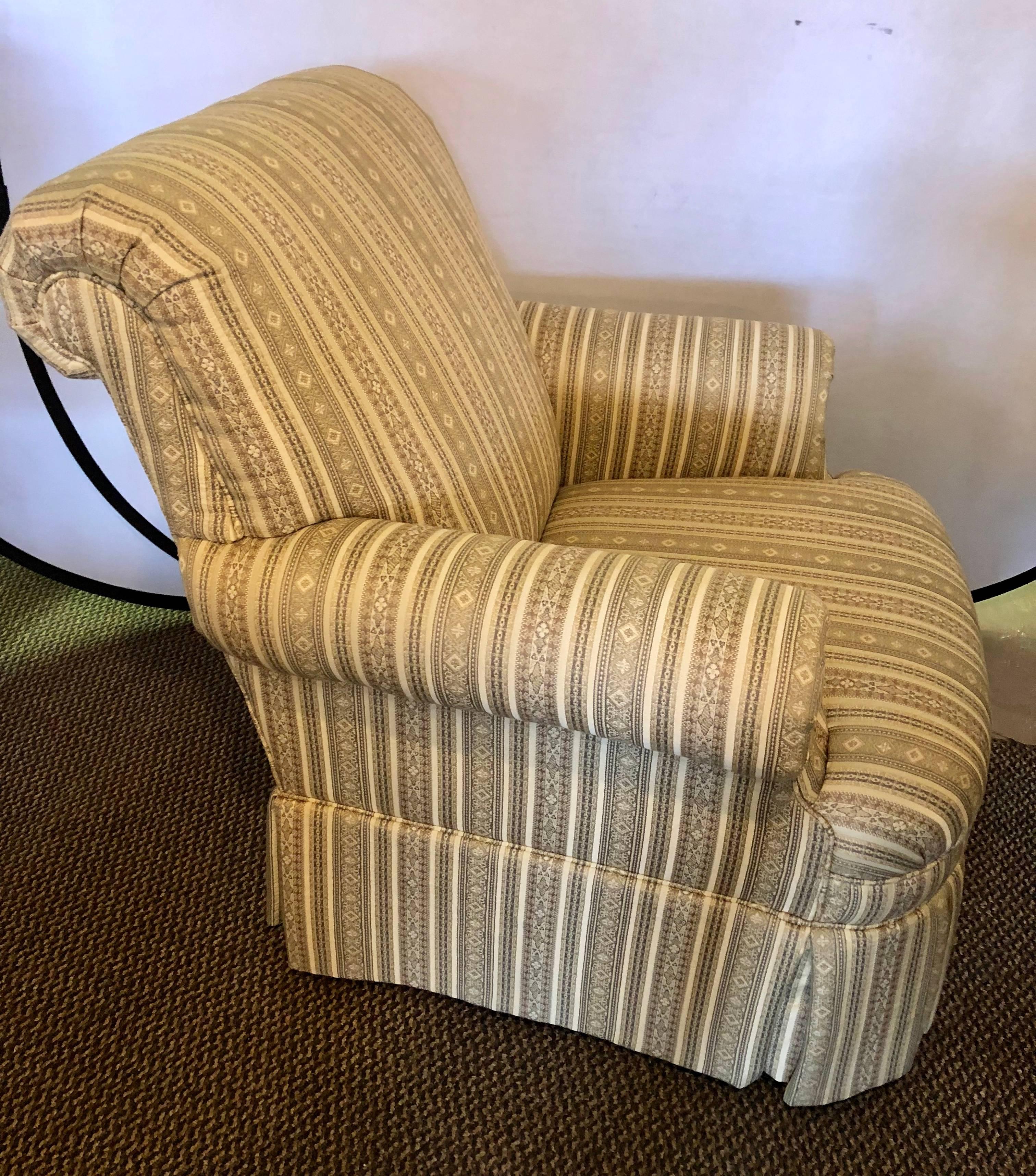 Pair of Hollywood Regency style custom overstuffed arm / lounge chairs in fine fabric. Direct from a Long Island Gold Coast Mansion. Sharp, sleek and clean.