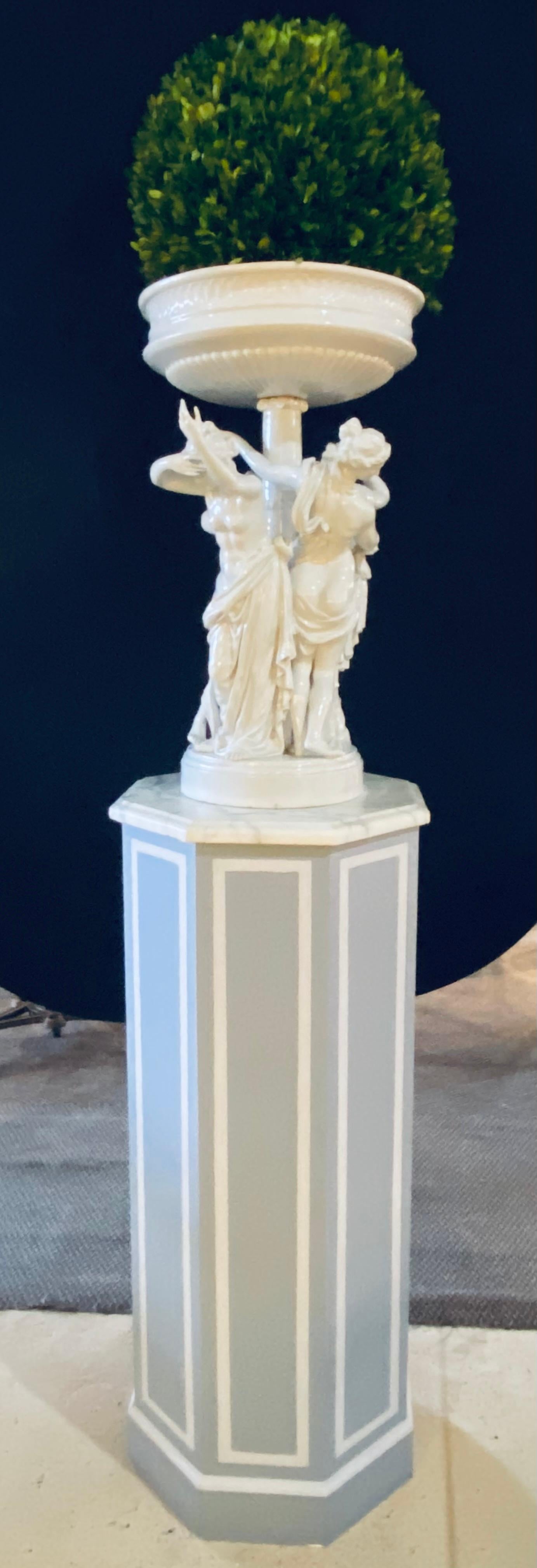 Pair of paint decorated wood Majestic pedestals with octagonal marble tops. These finely decorated marble top pedestals in the Hollywood Regency style are custom made to order and breathtaking. Each of octagonal form supporting white marble tops.