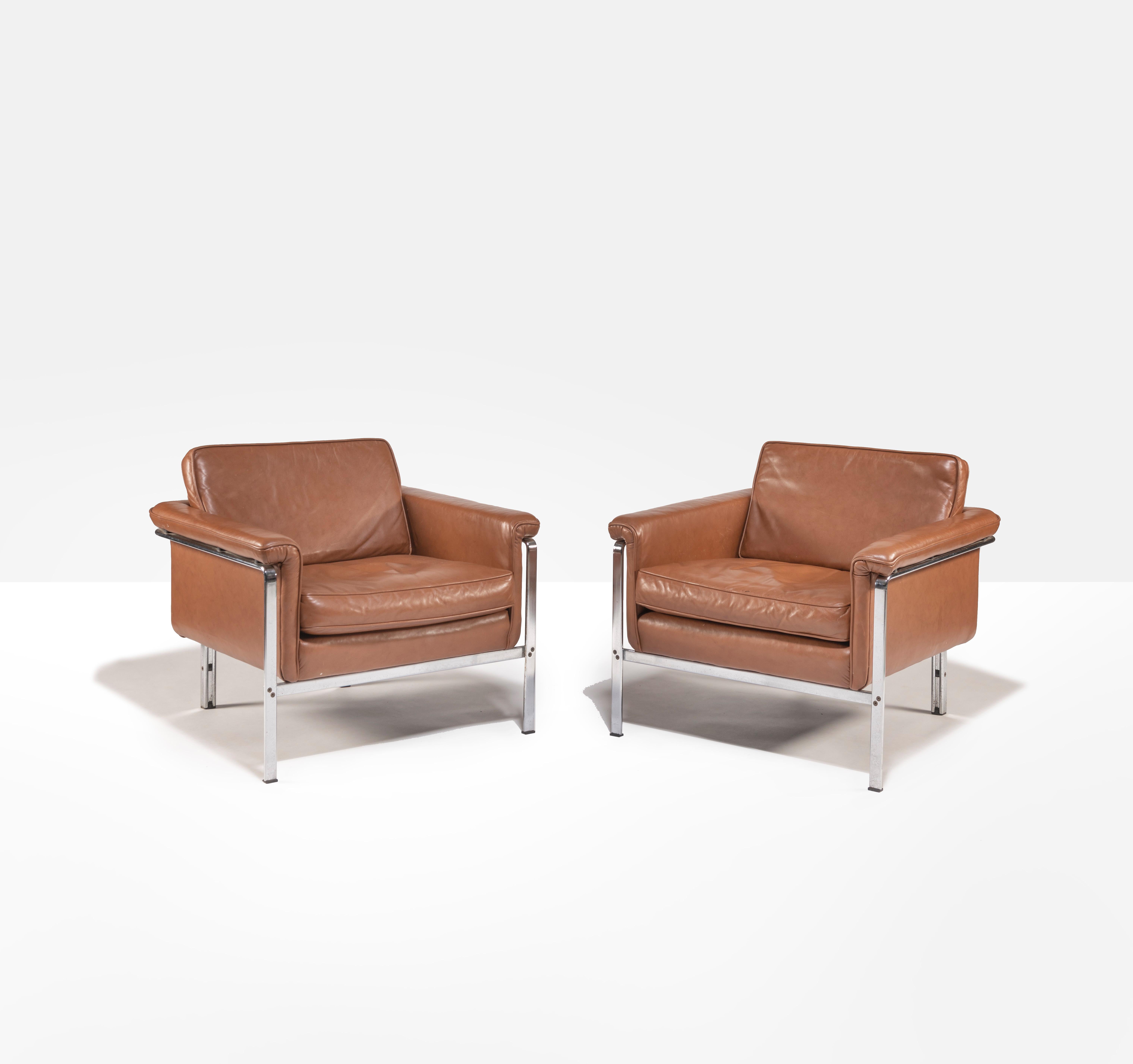 Pair lounge chairs model 6910 by Horst Brüning for Alfred Kill International. Leather and steel, Germany, 1967. Handsome and comfortable pair of lounge chairs in very good condition with original cognac leather.