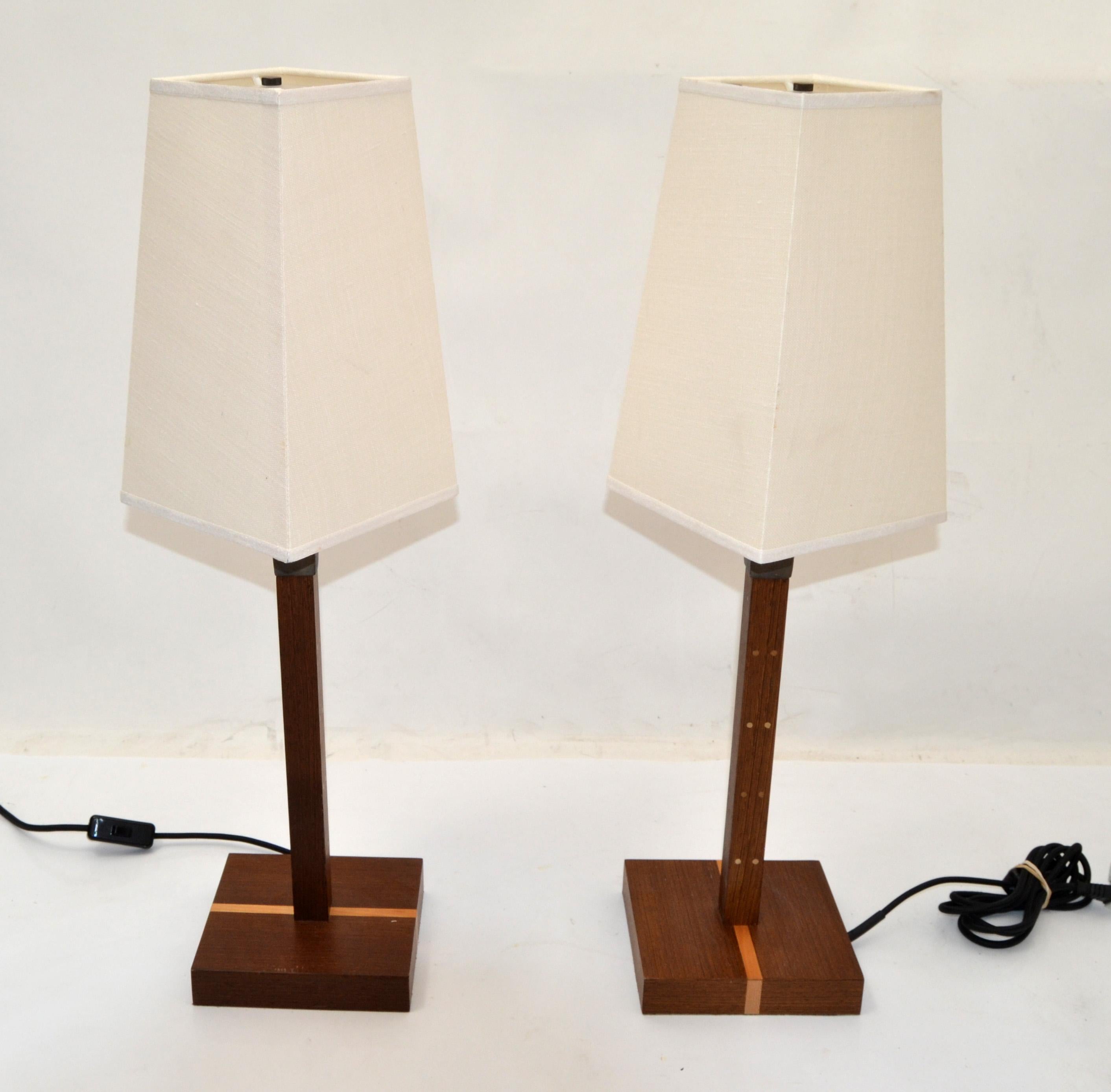 Pair, Ida lamps designed by Romeo Sozzi circa 1990 for Promemoria made in Italy.
Mid-Century Modern cool design made out of Wenge Wood, hammered Bronze, Acrylic and crowned with a Linen Shade.
US Rewiring with Cord switch, UL listed and marked at