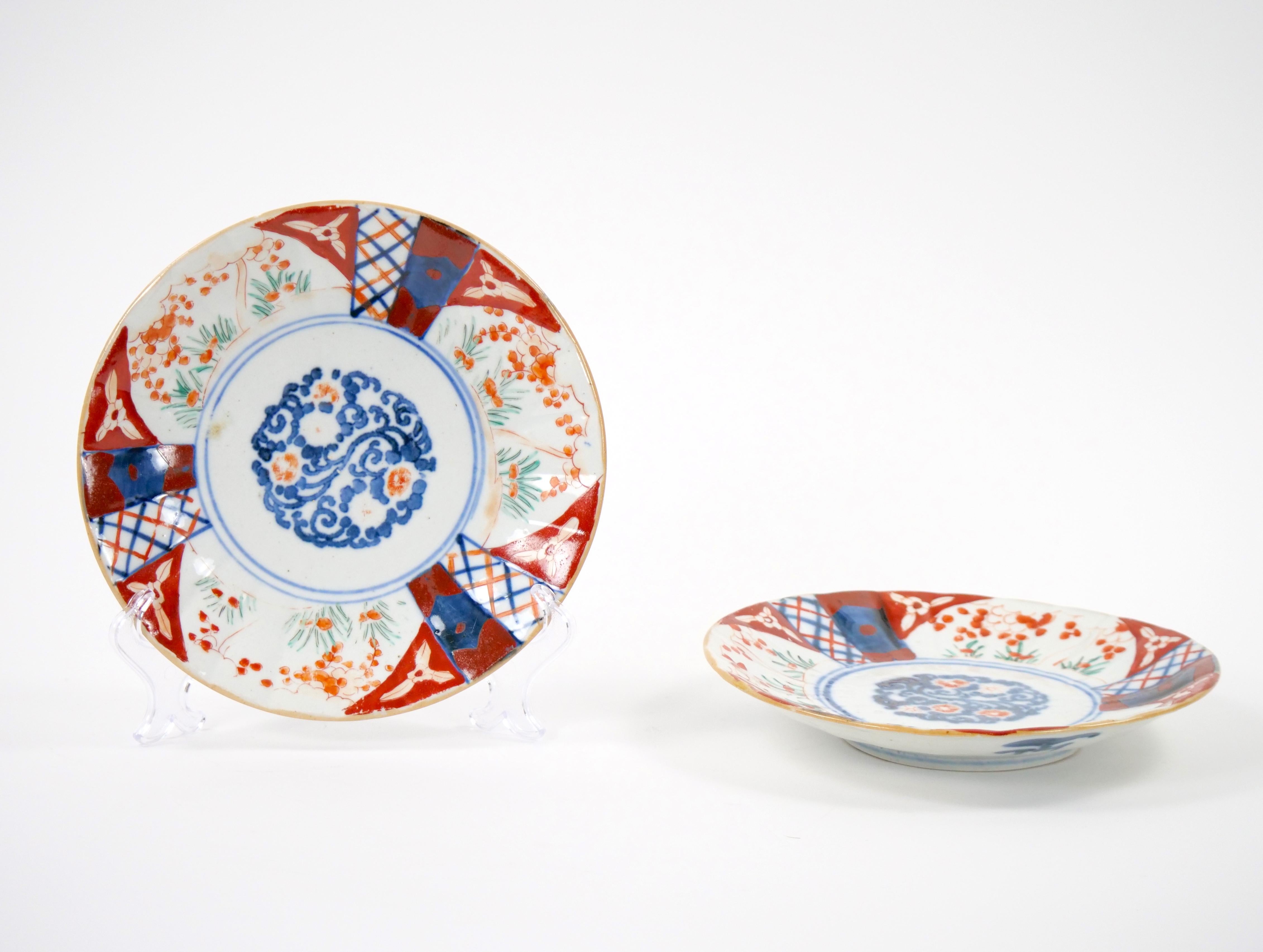Journey back in time to the 19th century with this captivating pair of Imari Porcelain Chinese Export Decorative Plates. These plates encapsulate the essence of a bygone era, where the artistry of Chinese porcelain met global admiration. Each plate