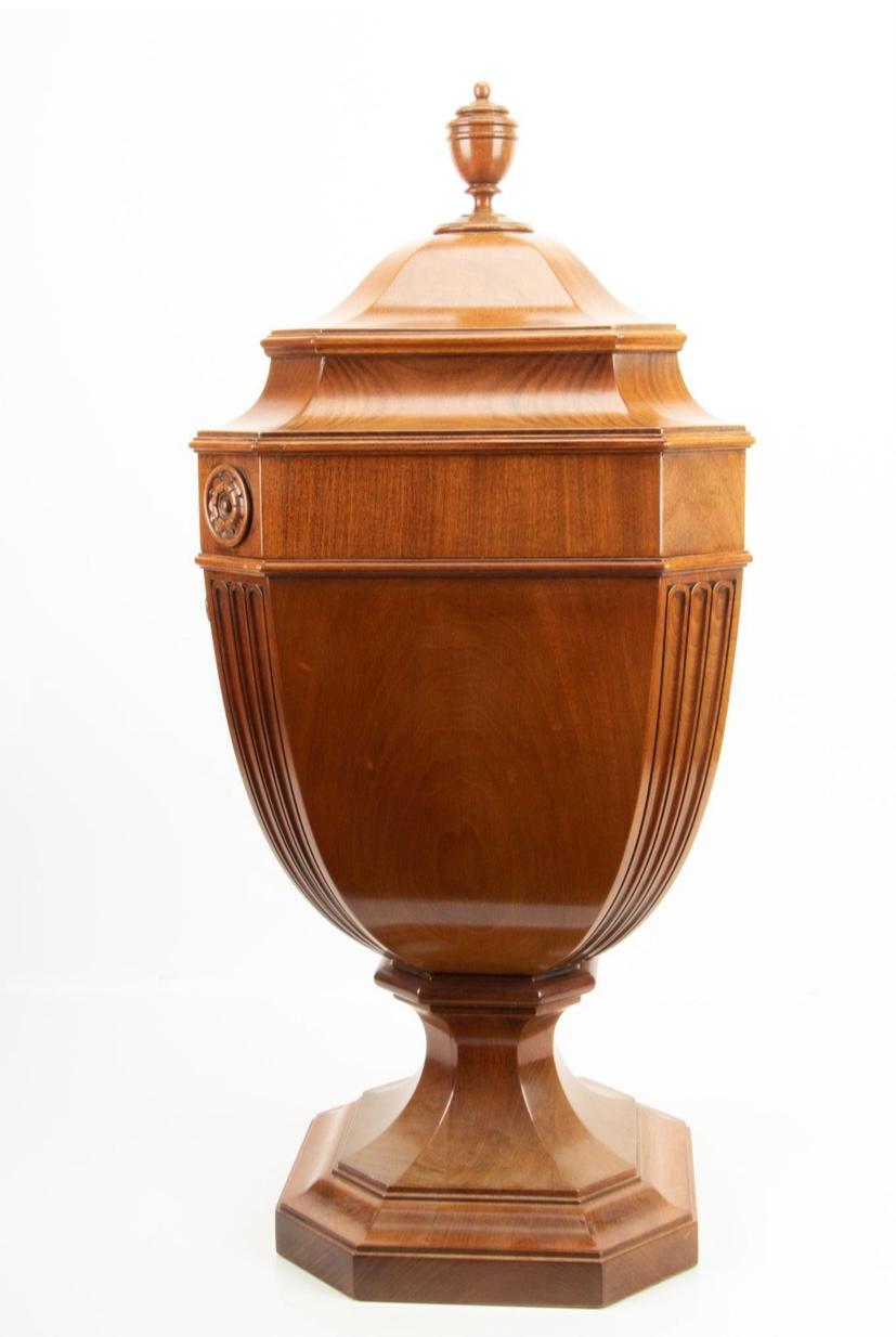A fine and impressive pair of knife urns by the custom cabinet maker W.K. Cowan of Chicago. Hand crafted to his exacting standards this pair features urn finials, and telescoping lid with spring tension lock mechanism in wonderful condition and