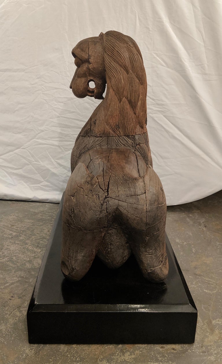 Pair of Indian Carved Teak Ceremonial Recumbent Lions, circa 1880 For Sale at 1stdibs