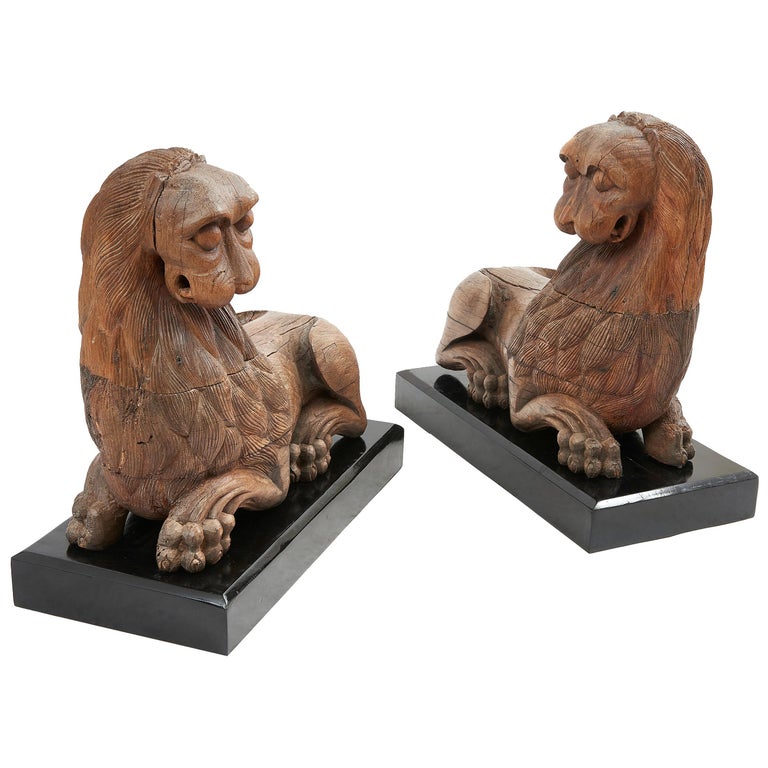 Pair of Indian Carved Teak Ceremonial Recumbent Lions, circa 1880 For Sale at 1stdibs