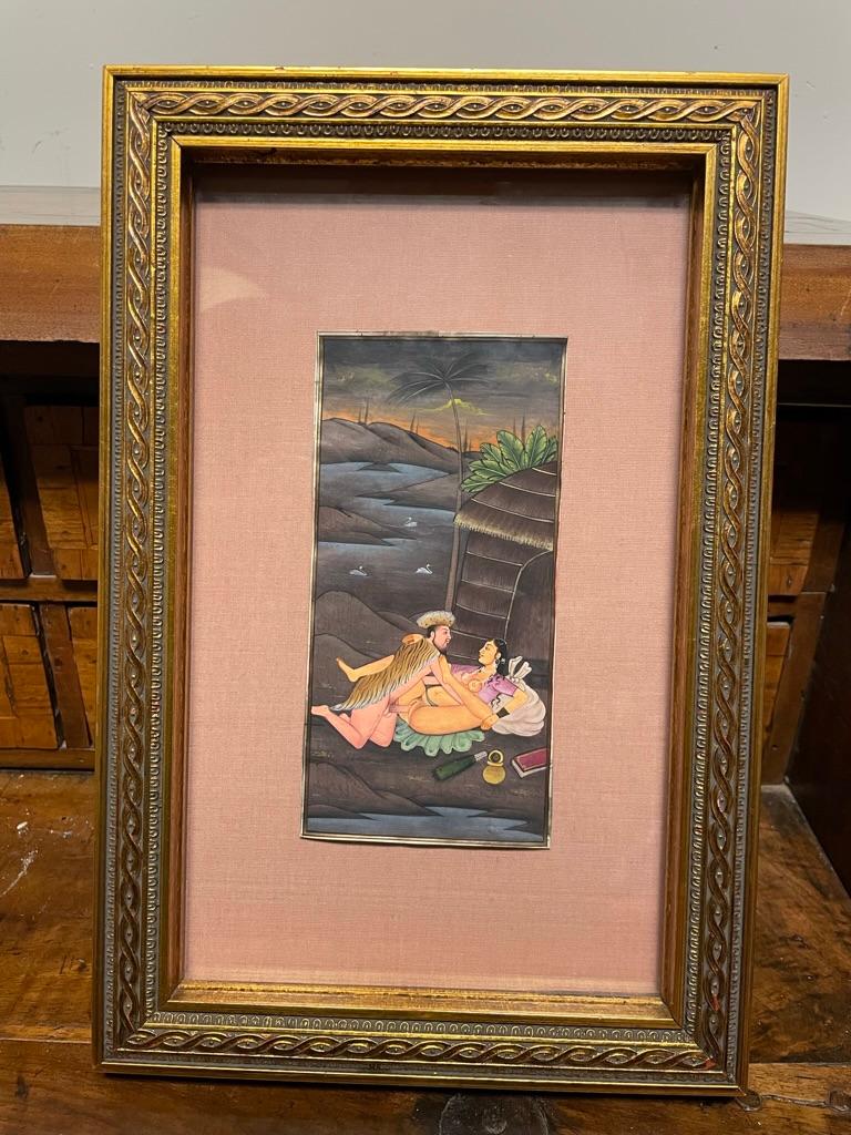 A pair of late 19th century high quality Indian erotic gouache paintings depicting male and female couples in Kama Sutra poses. The first with a border of pink flowers and lovely apple-green background, the couple shown on a rug in front of a white